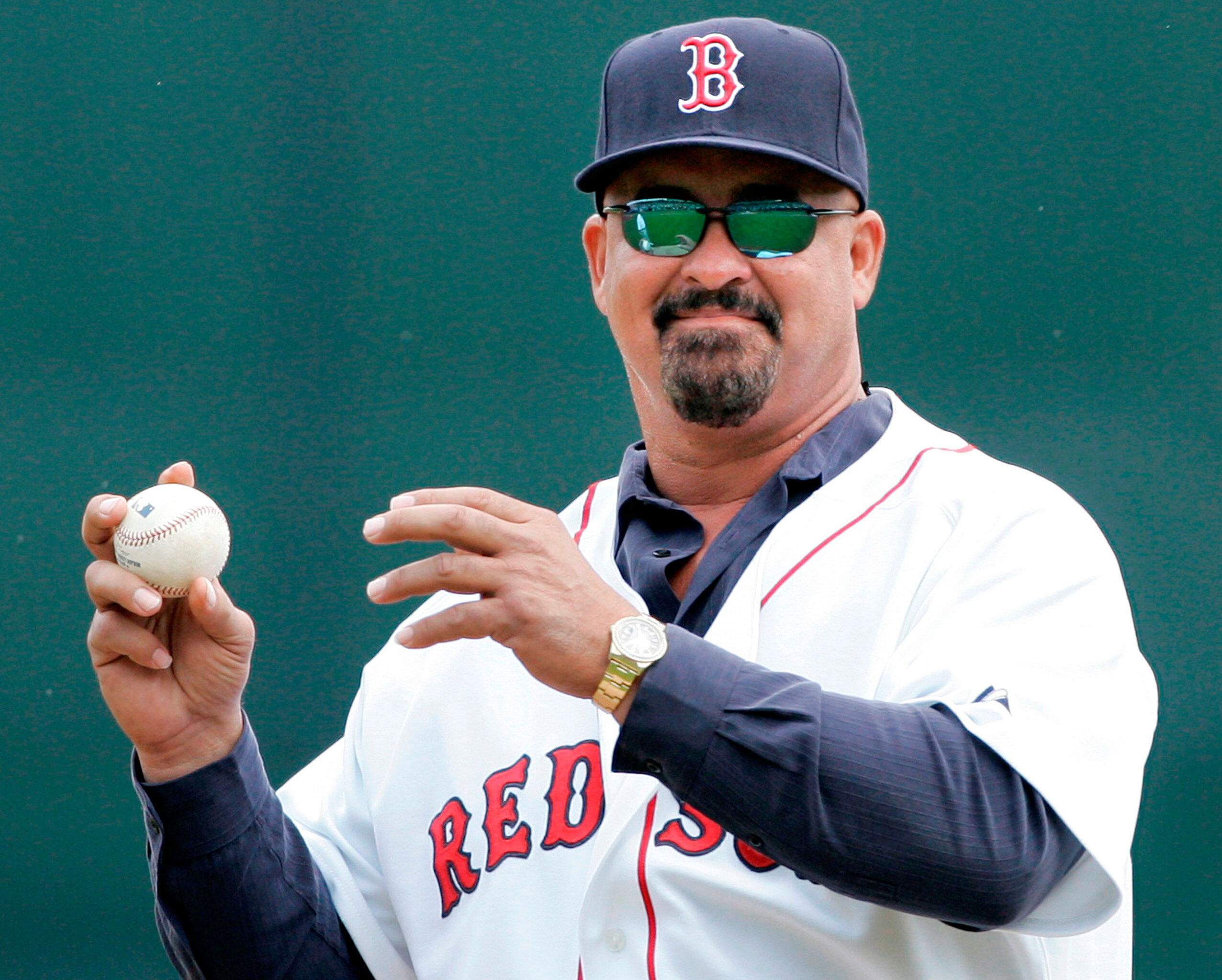 FILE - Former Boston Red Sox pluaer Mike Greenwell sets to throw out the ceremonial first pitch prior to the Red Sox-New York Mets spring training baseball game in Fort Myers, Fla., Tuesday March 11, 2008.