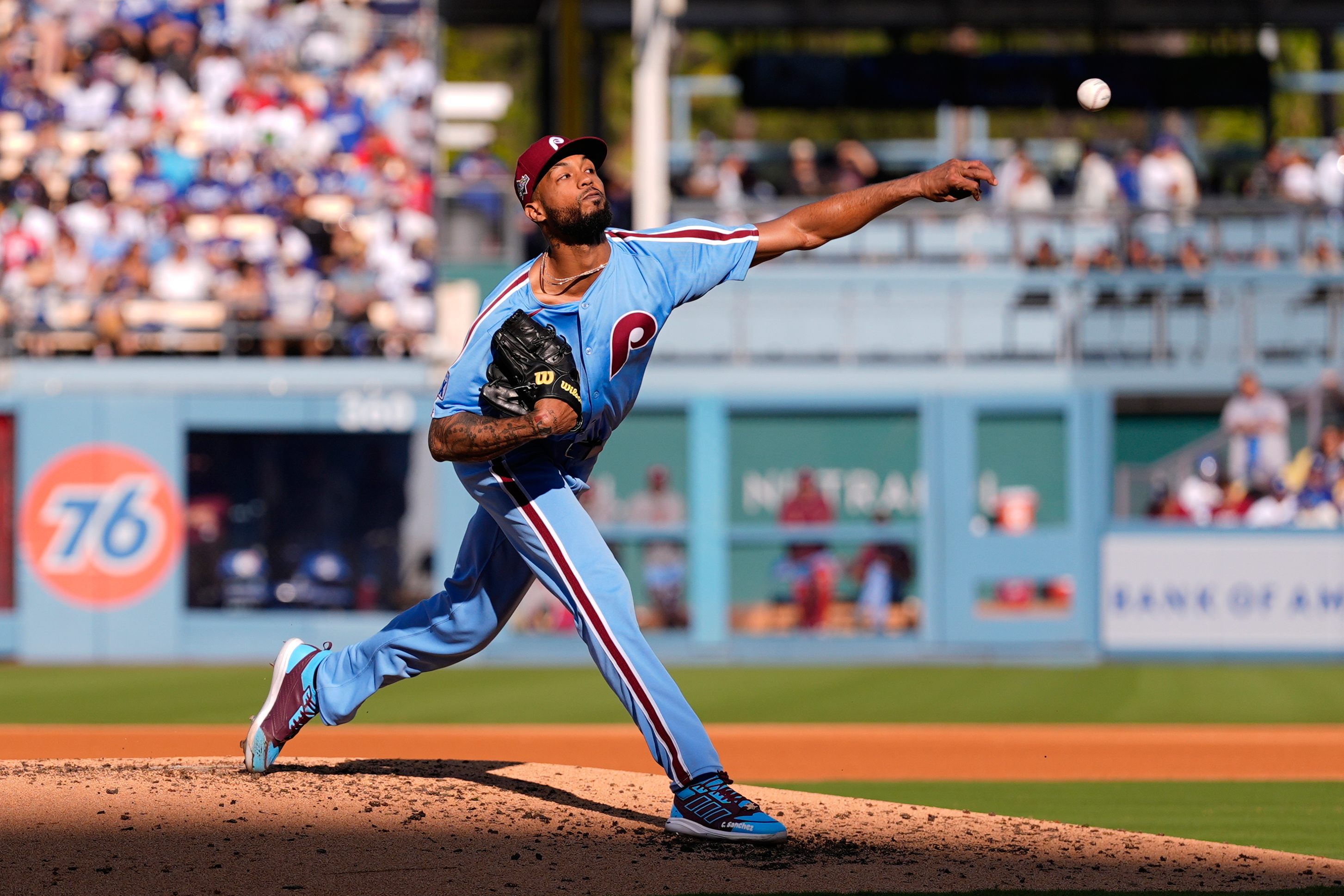 Philadelphia Phillies starting pitcher Cristopher Sánchez throws to a Los Angeles Dodgers batter during the fourth inning in Game 4 of baseball's National League Division Series Thursday, Oct. 9, 2025, in Los Angeles. 