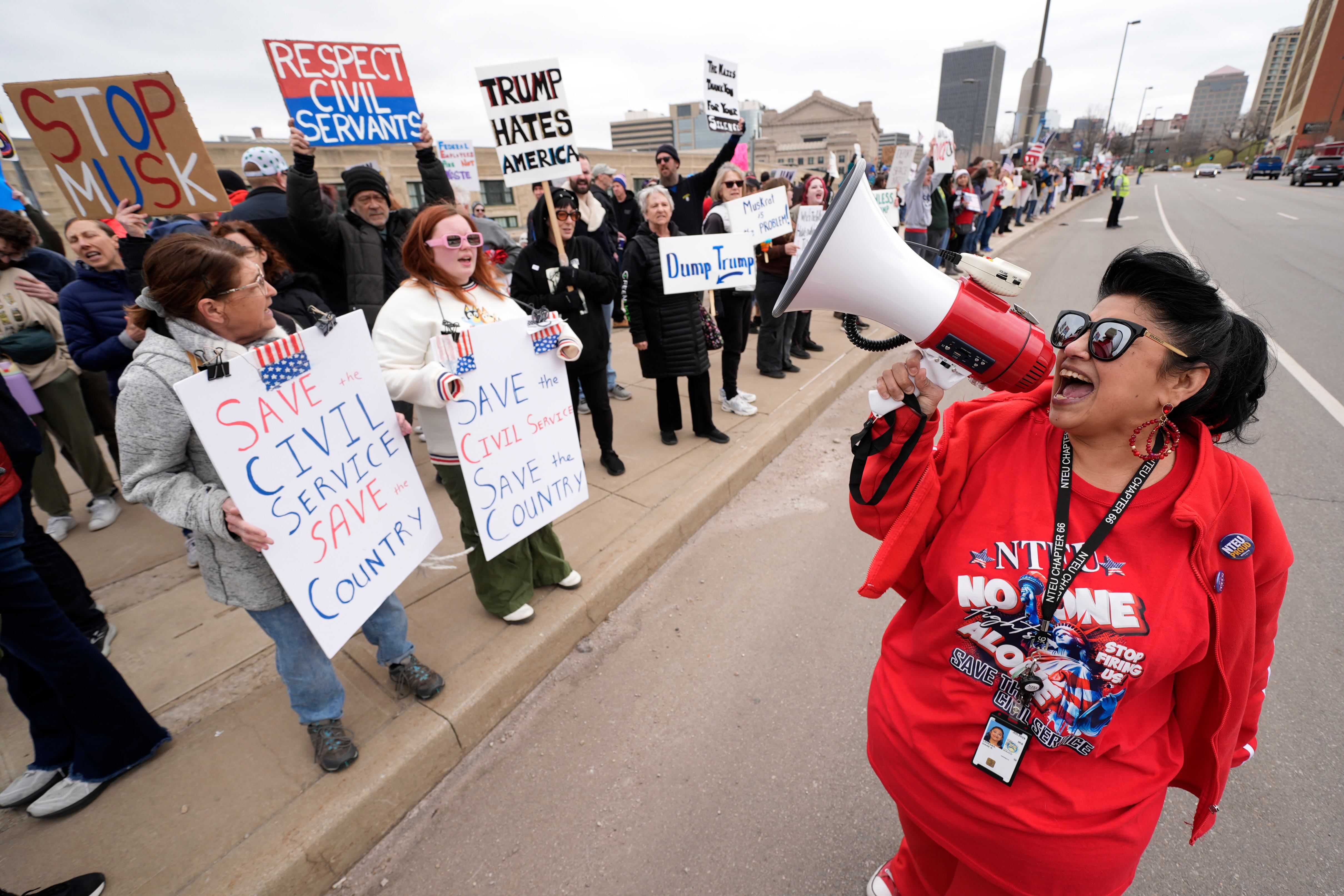 Internal Revenue Service employee Diane LeDesna leads protesters on March 15 in Kansas City, Mo. Federal workers in Utah are nervous after the IRS put its employees on unpaid leave on Thursday amid the government shutdown.