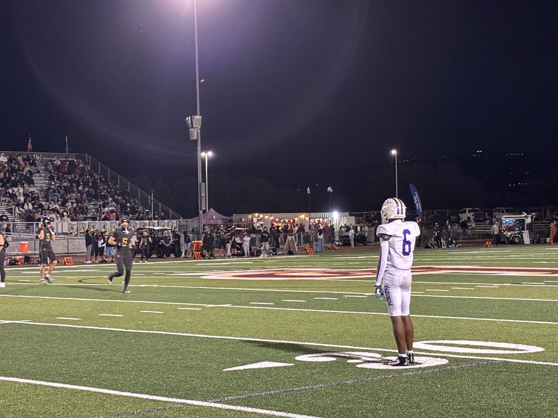 #6 Legend Glasker waits for the offense's play call during a game against Lone Peak.
