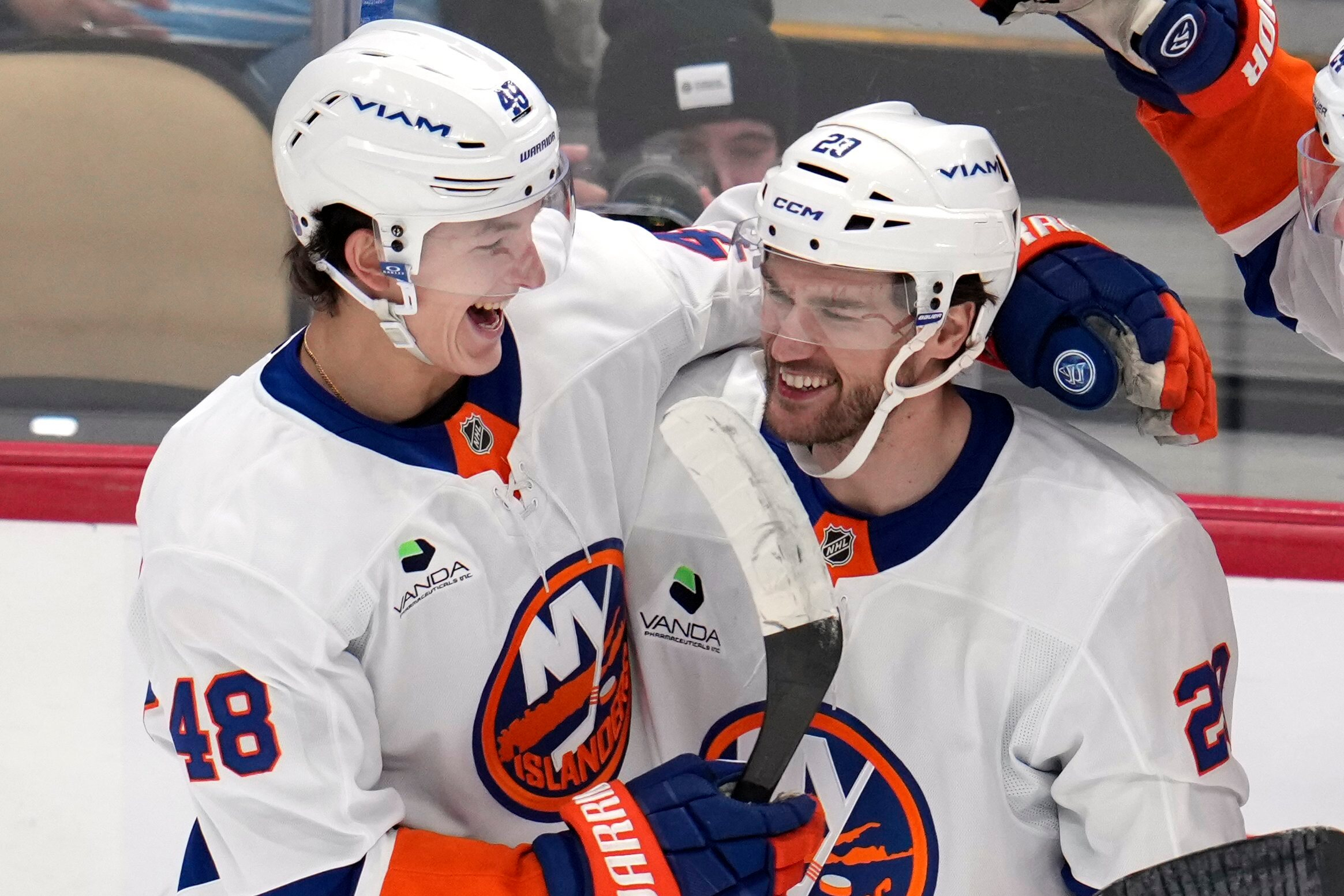 New York Islanders' Jonathan Drouin (29) celebrates after his goal with Matthew Schaefer (48) during the first period of an NHL hockey game against the Pittsburgh Penguins in Pittsburgh, Thursday, Oct. 9, 2025.