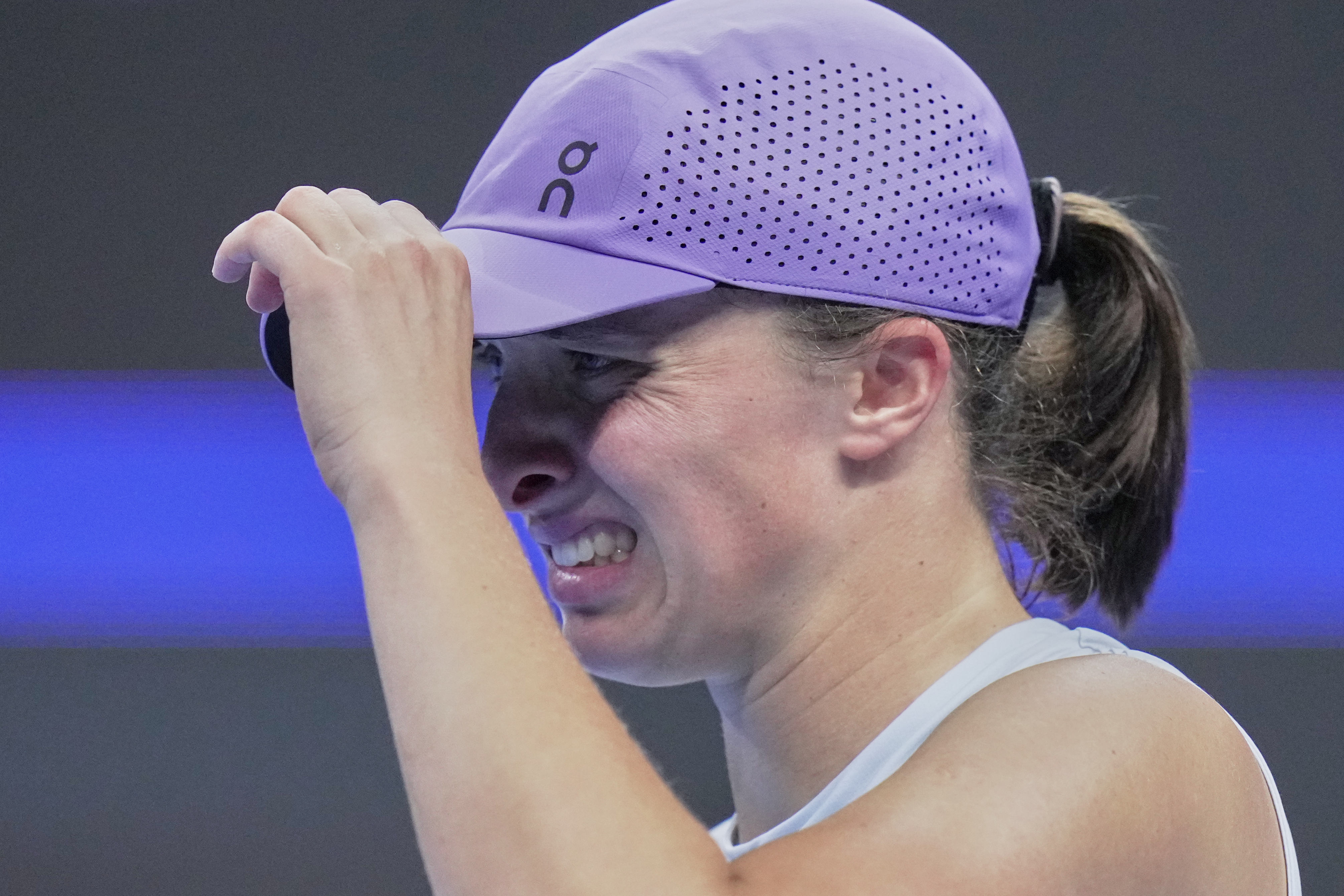 Iga Swiatek, of Poland reacts during the women's singles match against Emma Navarro, of the United States, in the China Open tennis tournament, at the National Tennis Center, in Beijing, Wednesday, Oct. 1, 2025.