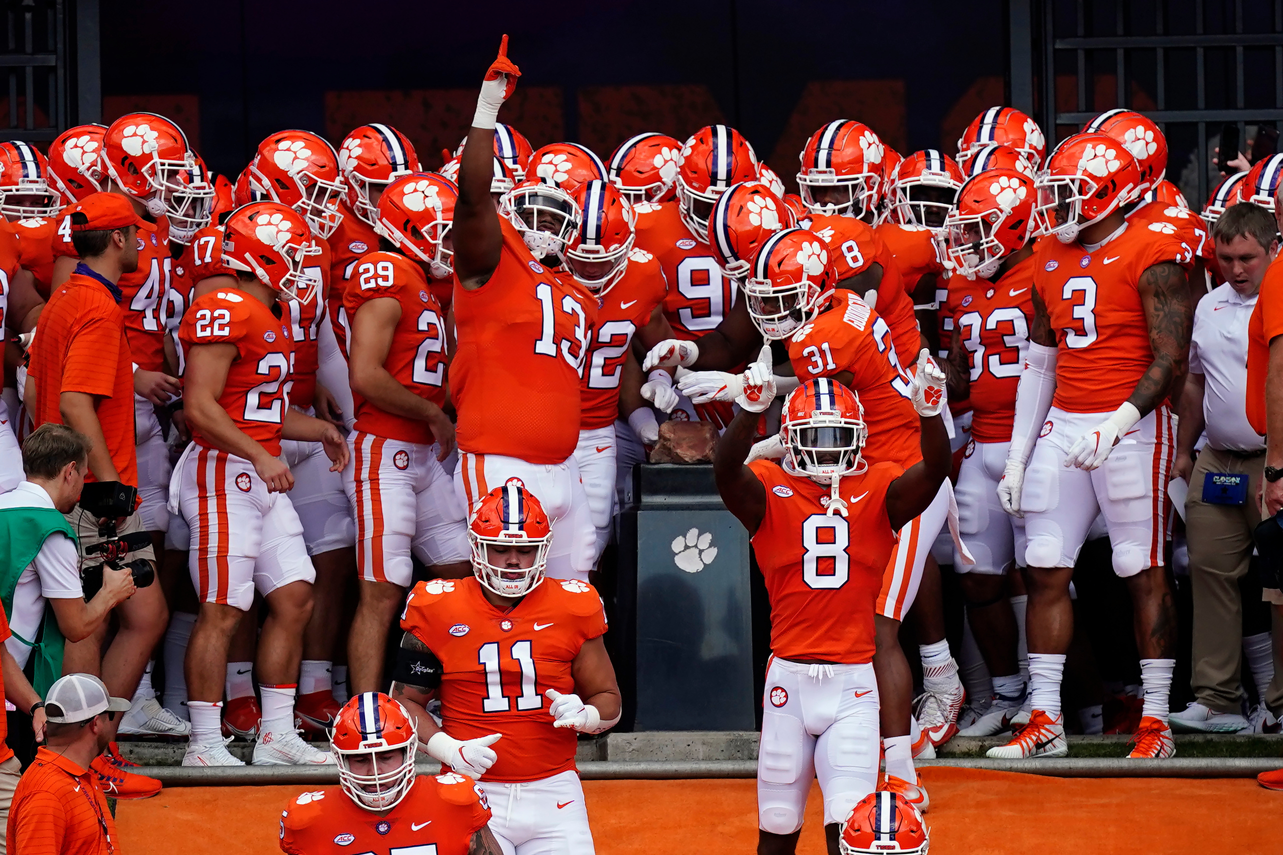 FILE - Clemson players touch Howard's Rock as they run onto the field for an NCAA college football game against Georgia Tech Saturday, Sept. 18, 2021, in Clemson, S.C.