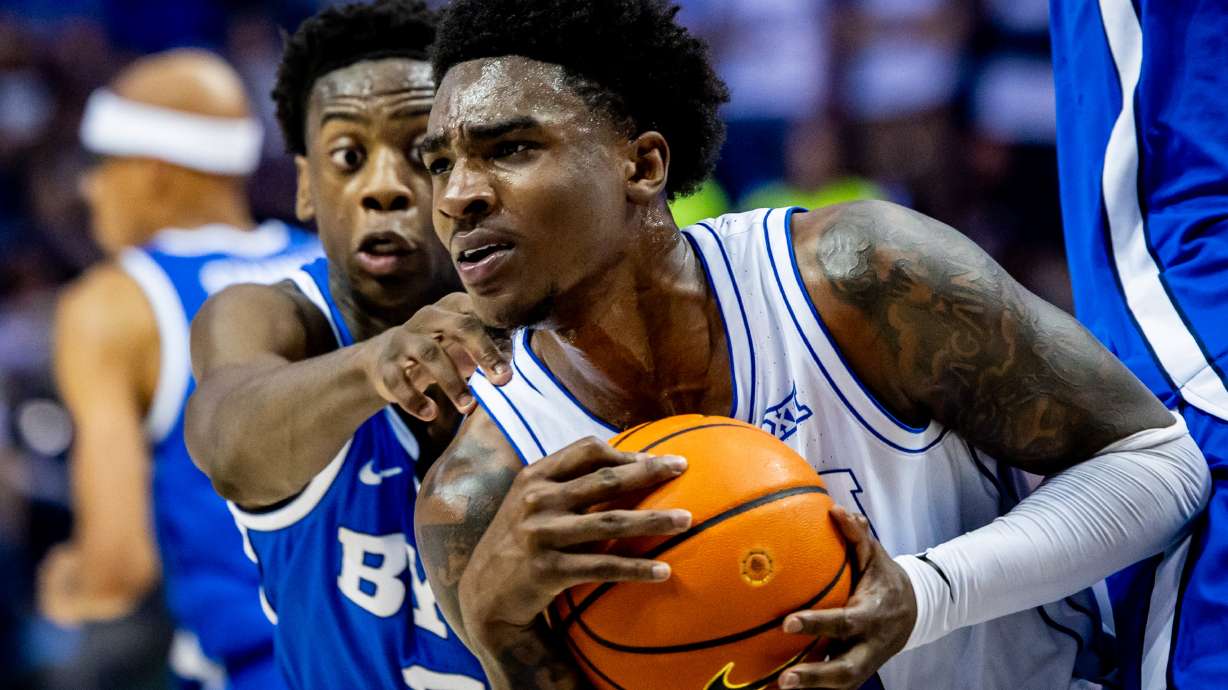 BYU's AJ Dybantsa (3) defends Kennard Davis Jr. (30), right, in their annual Blue-White Scrimmage at the Marriott Center in Provo on Thursday, Oct. 9, 2025.