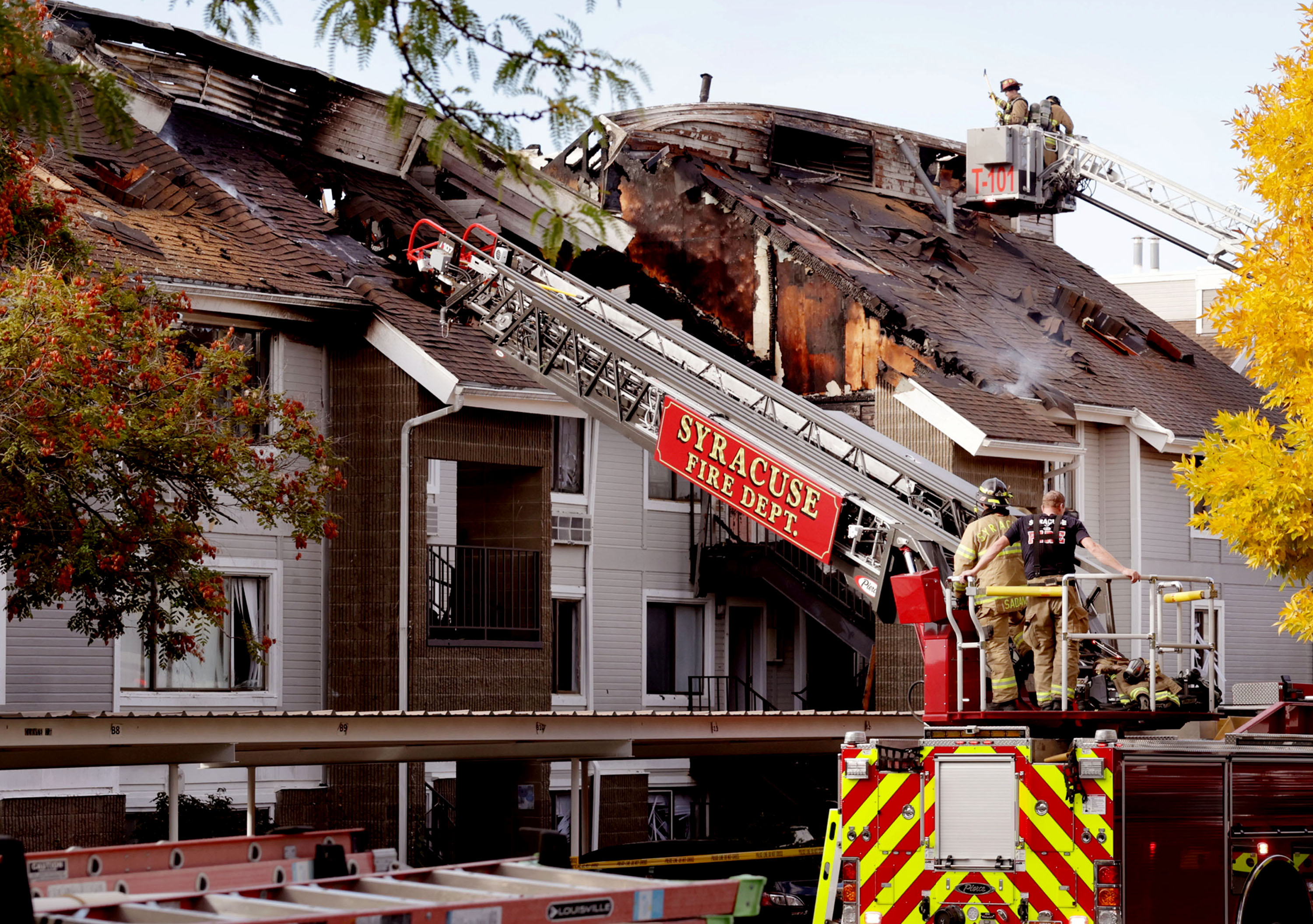 Syracuse and Layton firefighters extinguish a fire that impacted 24 units at Layton Meadows Apartments on Friday.