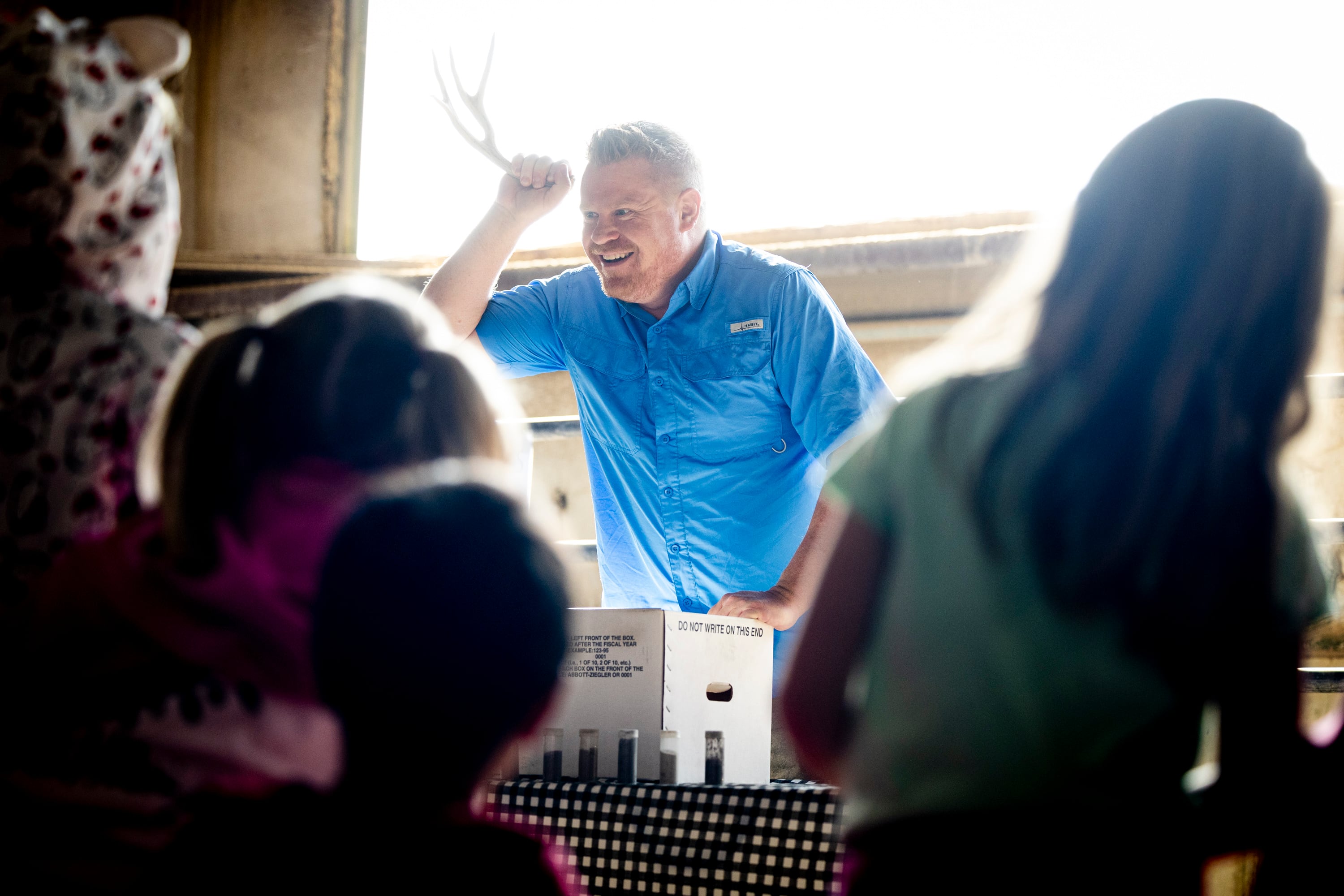 Daniel Gunnell, a resource coordinator with the Utah Department of Agriculture and Food, shows second graders an animal’s antlers as he talks about items that are linked to soil during Utah County Farm Field Days held by the Utah Farm Bureau and Utah State University Extension at the North Utah County Equestrian Park in Highland on Thursday.