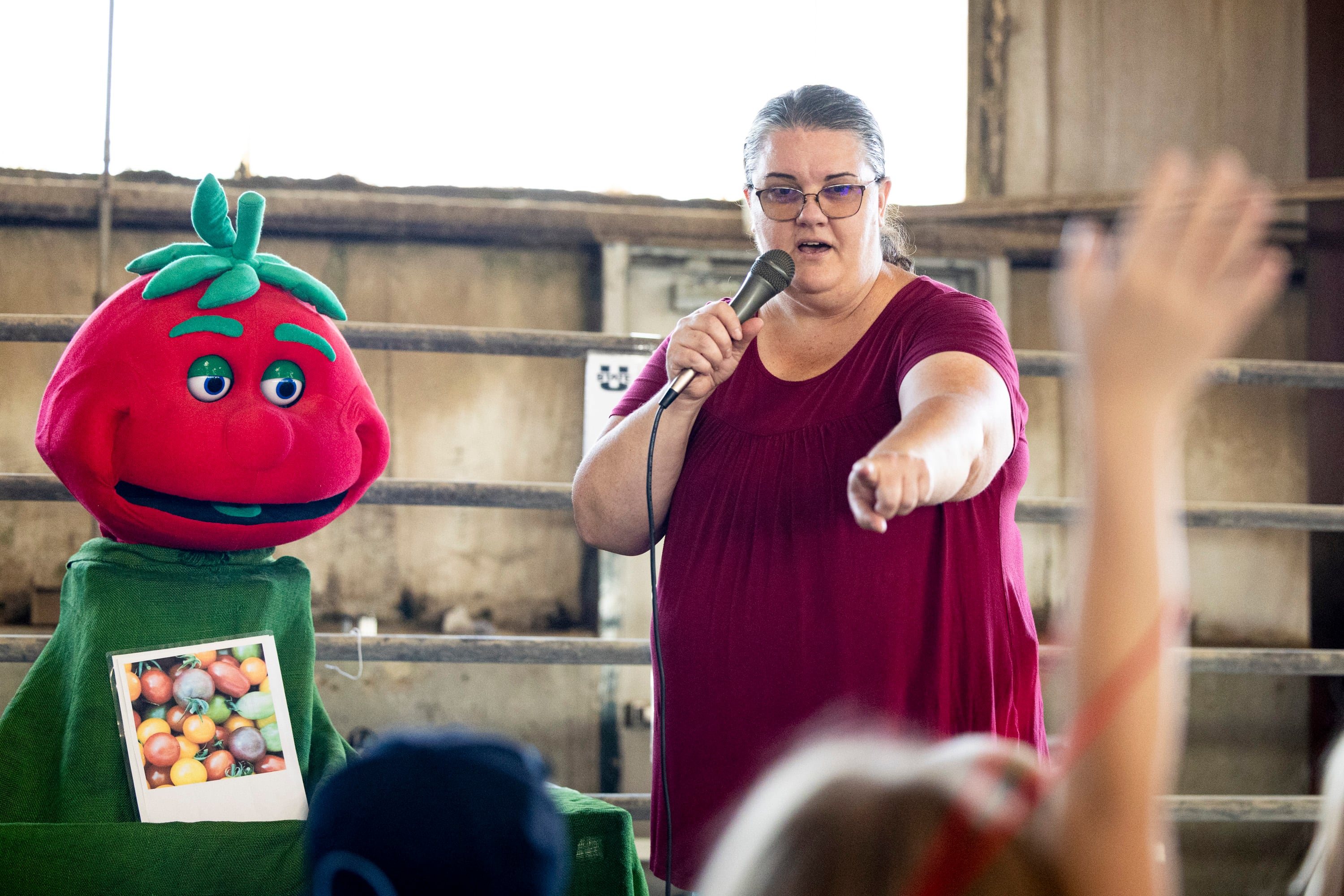 Lisa Zeigler, with the Utah State University Extension Master Gardener Program, points out a second grader to answer their question while she’s joined by Terry the Tomato, who speaks with the help of a volunteer, during Utah County Farm Field Days held by the Utah Farm Bureau and Utah State University Extension at the North Utah County Equestrian Park in Highland on Thursday.