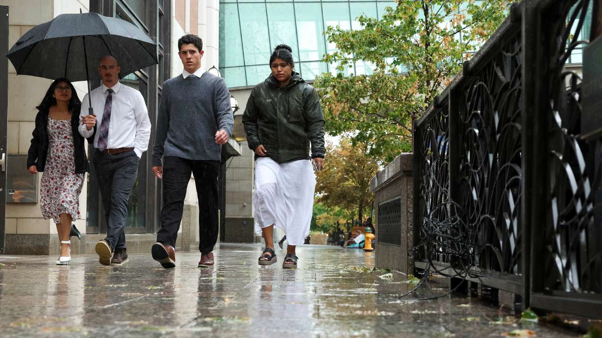 People downtown during a rainstorm in Salt Lake City on Oct. 4. Remnants of Hurricane Priscilla have already provided a lot of rain across Utah since Thursday, and more impacts are expected throughout the weekend.