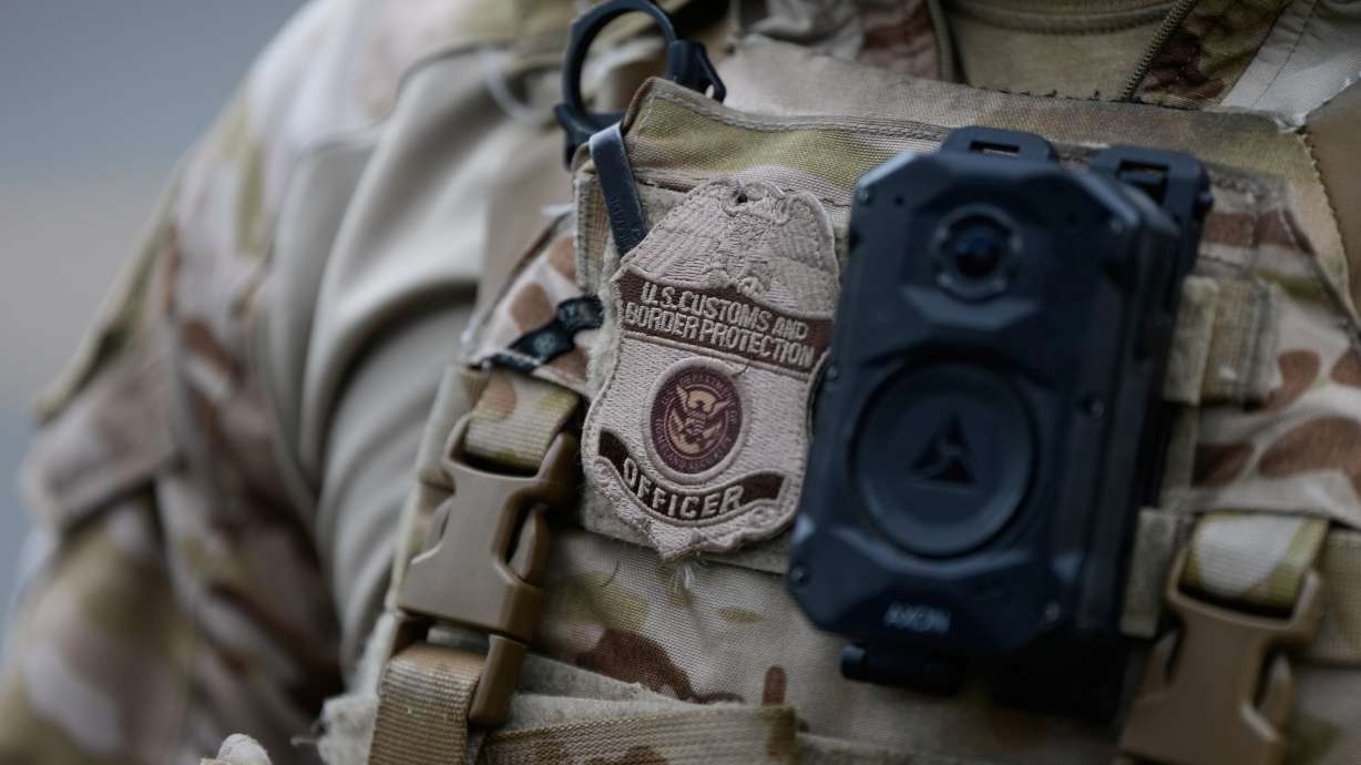 A Utah attorney warns of "cross-deputization" of non-Immigration and Customs Enforcement agents to aid with immigration enforcement. The Oct. 4 photo shows a Customs and Border Protection officer at an ICE facility in Portland, Oregon.