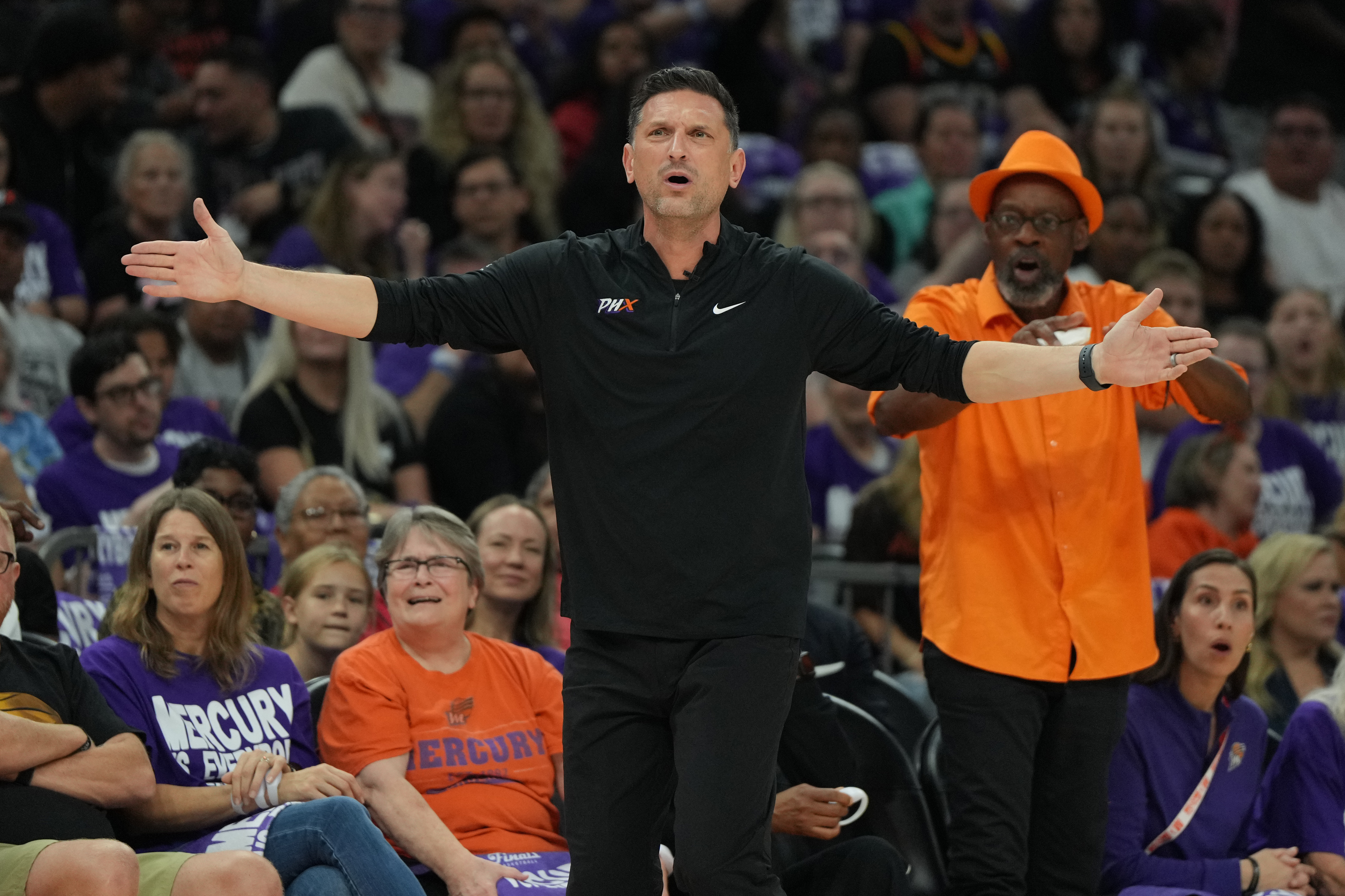 Phoenix Mercury head coach Nate Tibbetts reacts after a foul call against the Las Vegas Aces during the first half of Game 4 of the WNBA basketball finals, Friday, Oct. 10, 2025, in Phoenix.