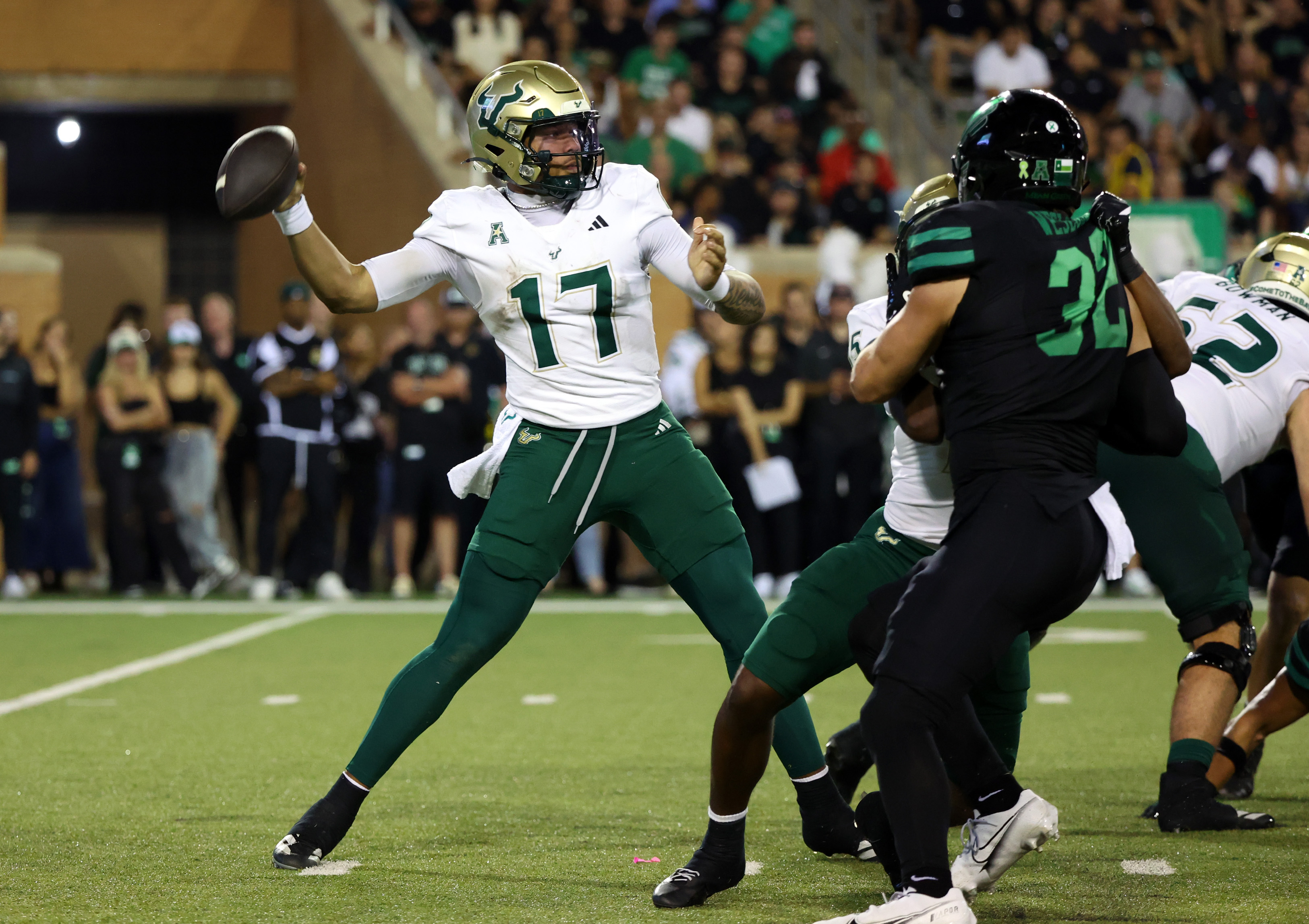 South Florida quarterback Byrum Brown (17) looks to throw a pass against North Texas in the second quarter of an NCAA college football game Friday, Oct. 10, 2025, in Denton, Texas.