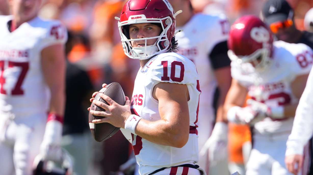 Oklahoma quarterback John Mateer warms up before an NCAA college football game against Texas at the Cotton Bowl, Saturday, Oct. 11, 2025, in Dallas.