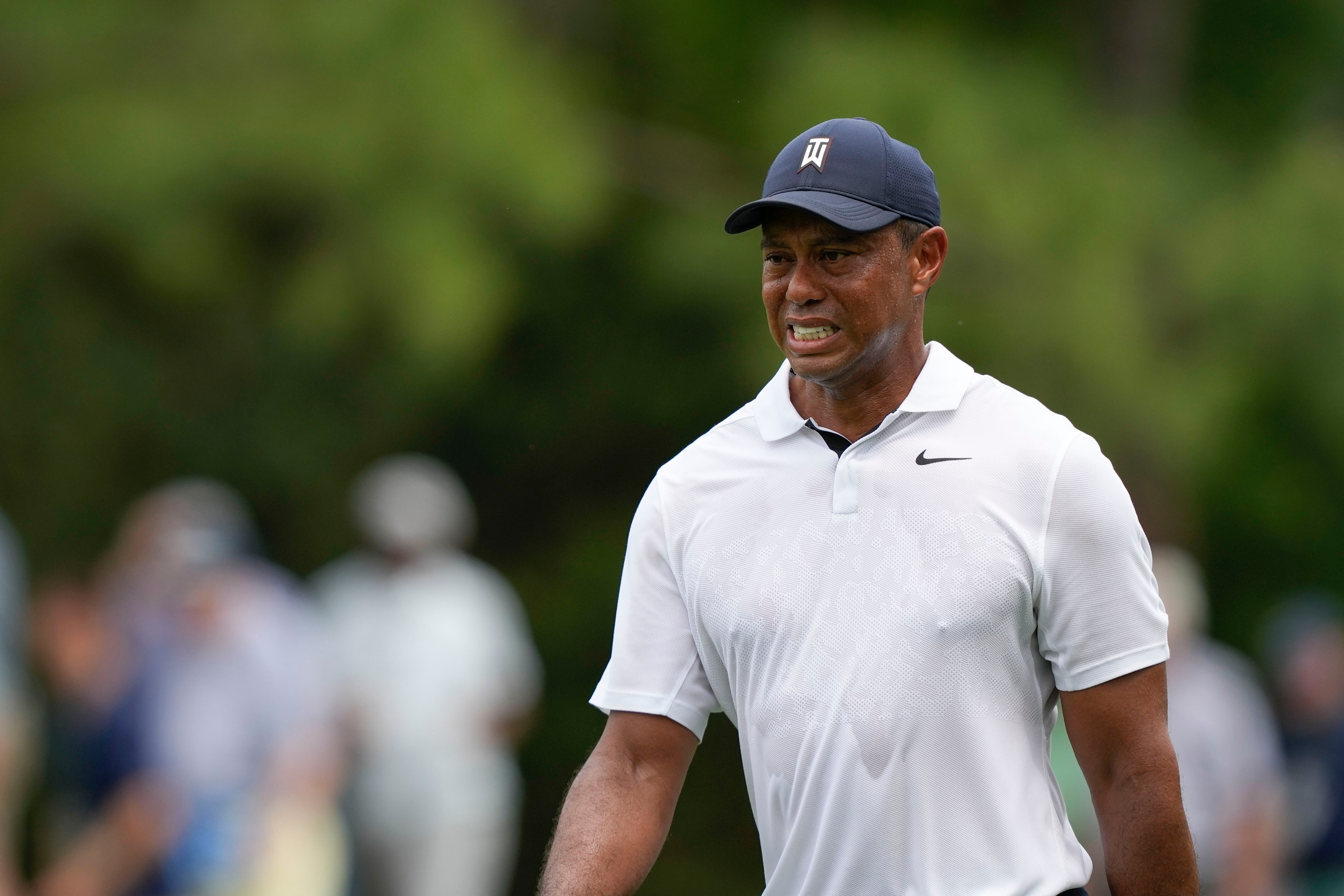 FILE - Tiger Woods grimaces on the 15th hole during the first round of the Masters golf tournament at Augusta National Golf Club on Thursday, April 6, 2023, in Augusta, Ga.