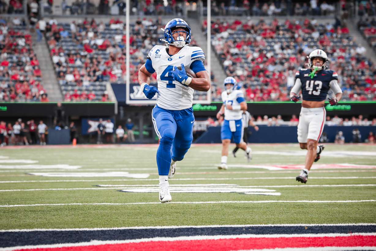 BYU's LJ Martin scores a 25-yard touchdown during a Big 12 football game against Arizona, Saturday, Oct. 11, 2025 in Tucson, Arizona.