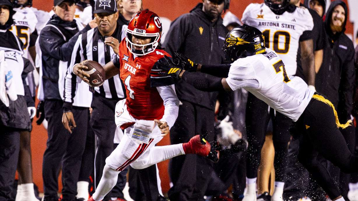 Utah quarterback Devon Dampier (4) runs the ball as he’s pushed out of bounds by Arizona State defensive back Montana Warren (7) during an NCAA football game held at Rice-Eccles Stadium in Salt Lake City on Saturday, Oct. 11, 2025.