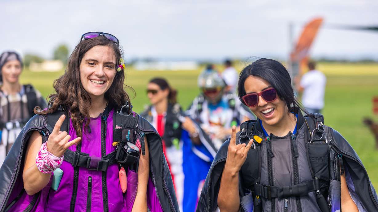 Wingsuit flyers Becca Jordan (left) and Elizabeth Brott (right) set a world record for the most grips in a round as one of the first all-female teams at the FIA World Cup of Wingsuit Flying in the Czech Republic.
