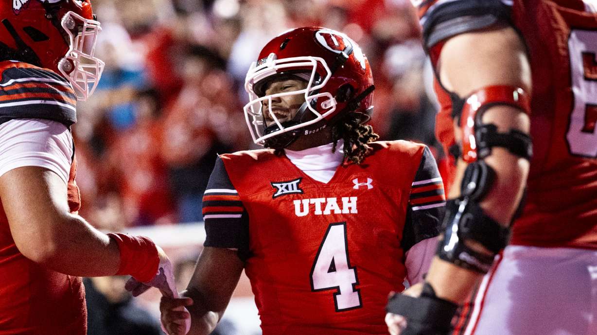 Utah quarterback Devon Dampier (4) celebrates his touchdown with his teammates during an NCAA football game against Arizona State held at Rice-Eccles Stadium in Salt Lake City on Saturday, Oct. 11, 2025.