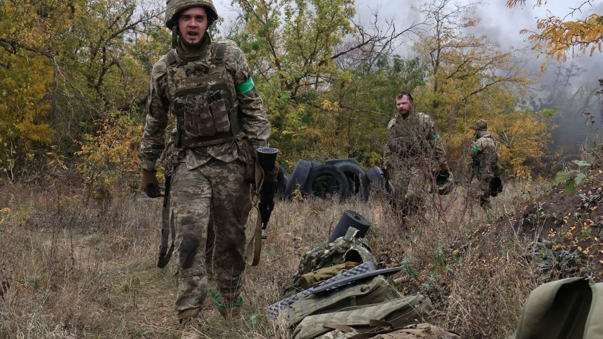 In this photo provided by Ukraine's 65th Mechanized Brigade press service, recruits attend drills at a training ground in the Zaporizhzhia region, Ukraine, Saturday.