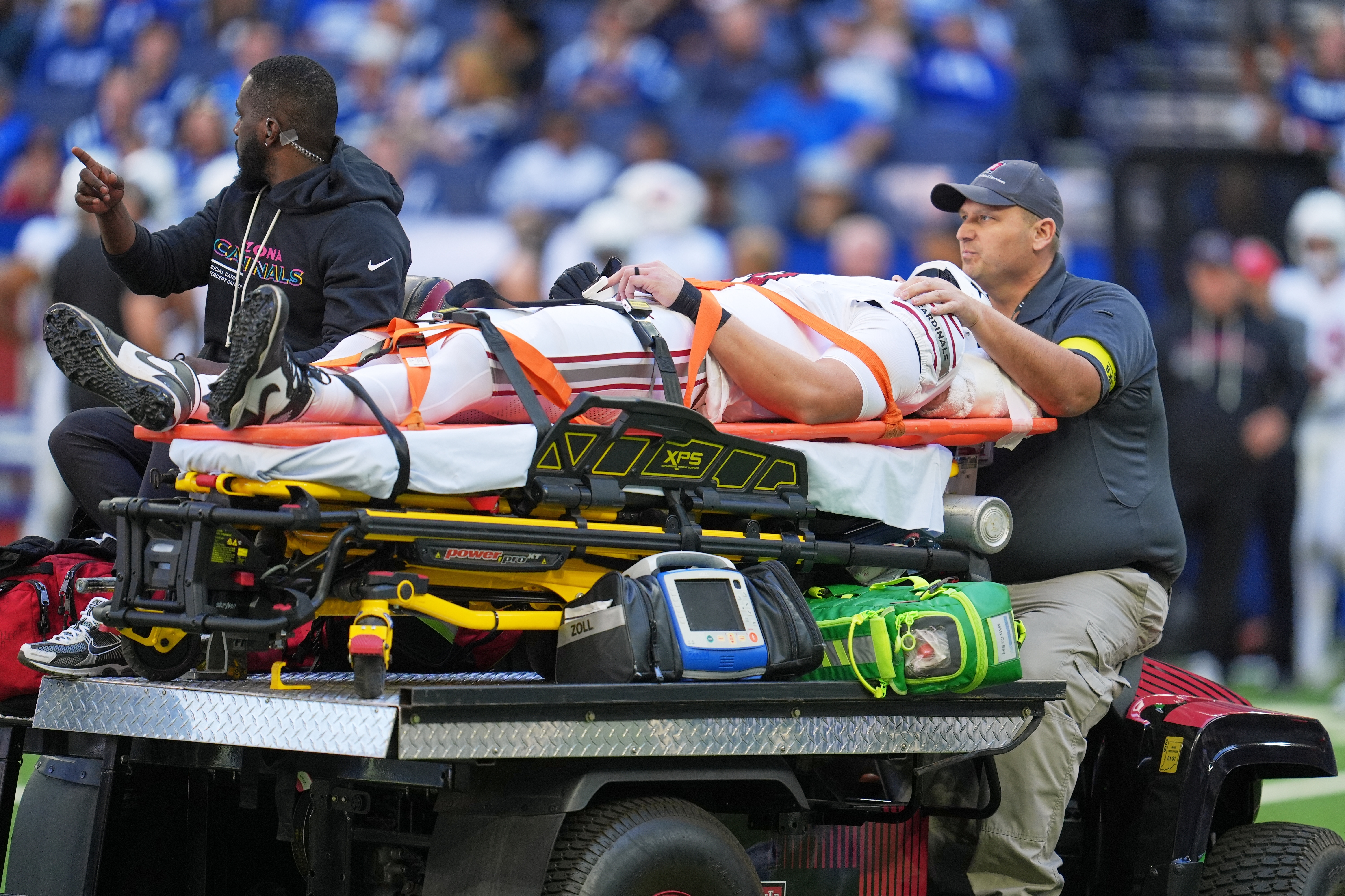 Arizona Cardinals' Travis Vokolek is taken off the field on a cart during the first half of an NFL football game against the Indianapolis Colts Sunday, Oct. 12, 2025, in Indianapolis. 