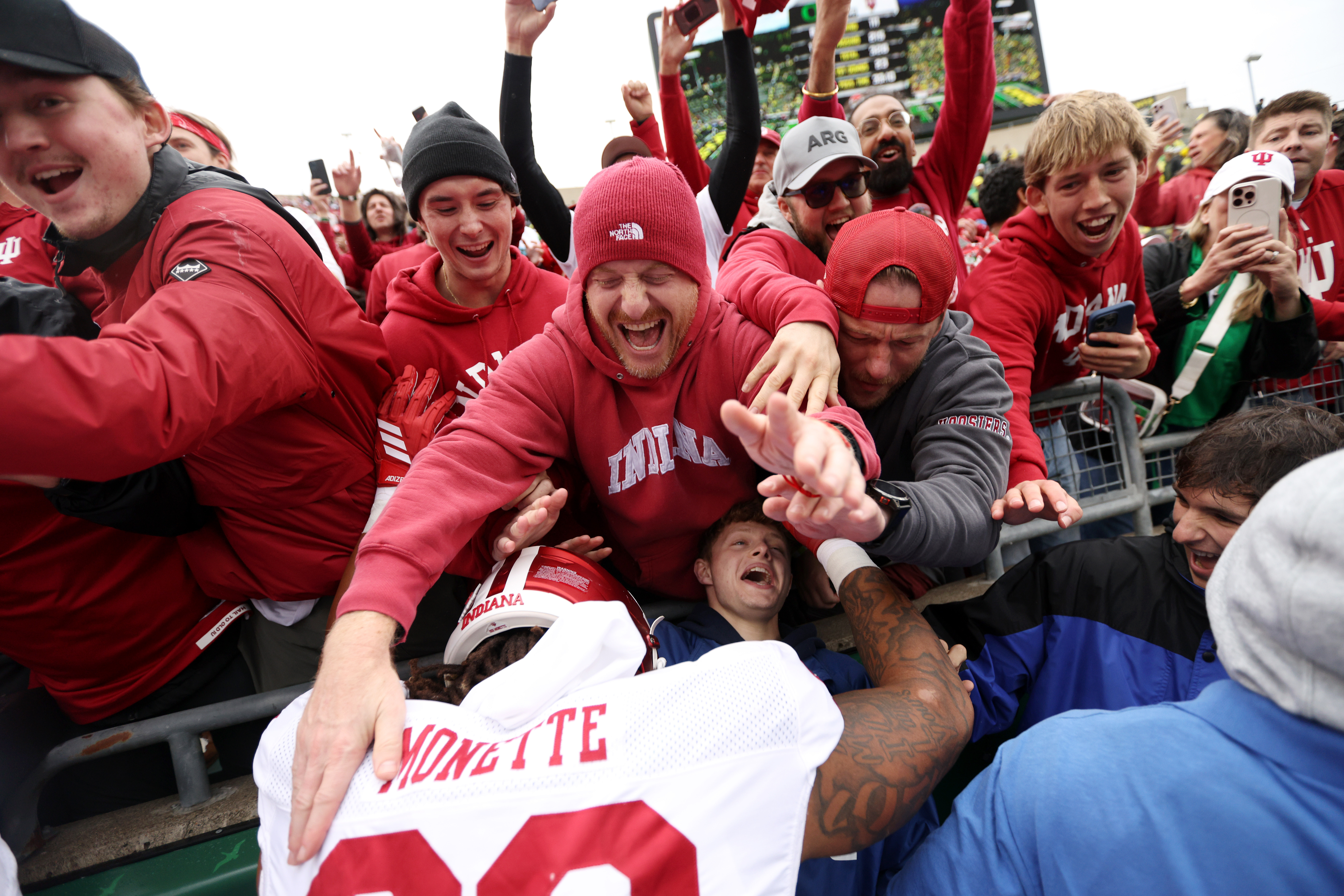 Indiana defensive lineman J'Mari Monnette, bottom,) celebrates after an NCAA college football game against Oregon, Saturday, Oct. 11, 2025, in Eugene, Ore. 