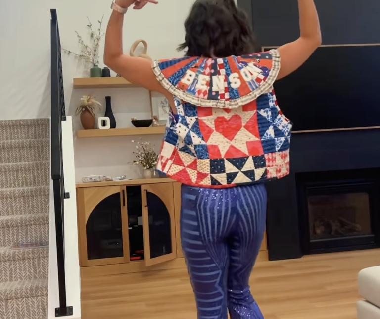 Chelsea Porter, of northern Utah, models the quilted vest she sewed for Benson Boone before the concert in Salt Lake City on Thursday, Oct. 9.
