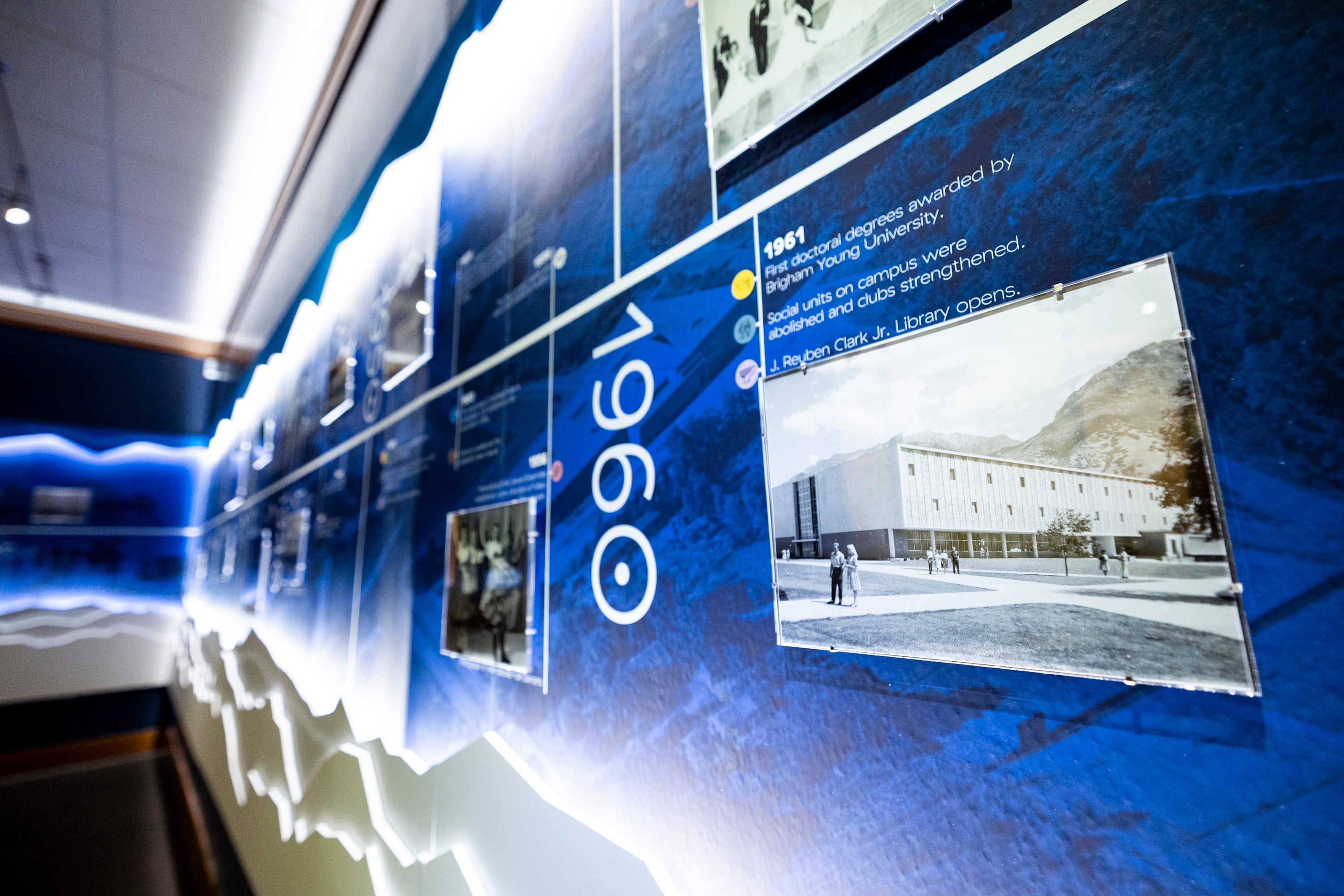 A photograph of the J. Reuben Clark Jr. Library from 1961 is displayed on a timeline as part of an exhibit titled, “By Study and By Faith: 150 Years of Brigham Young University,” on the first floor of the Harold B. Lee Library on the campus of BYU in Provo on Oct. 2.