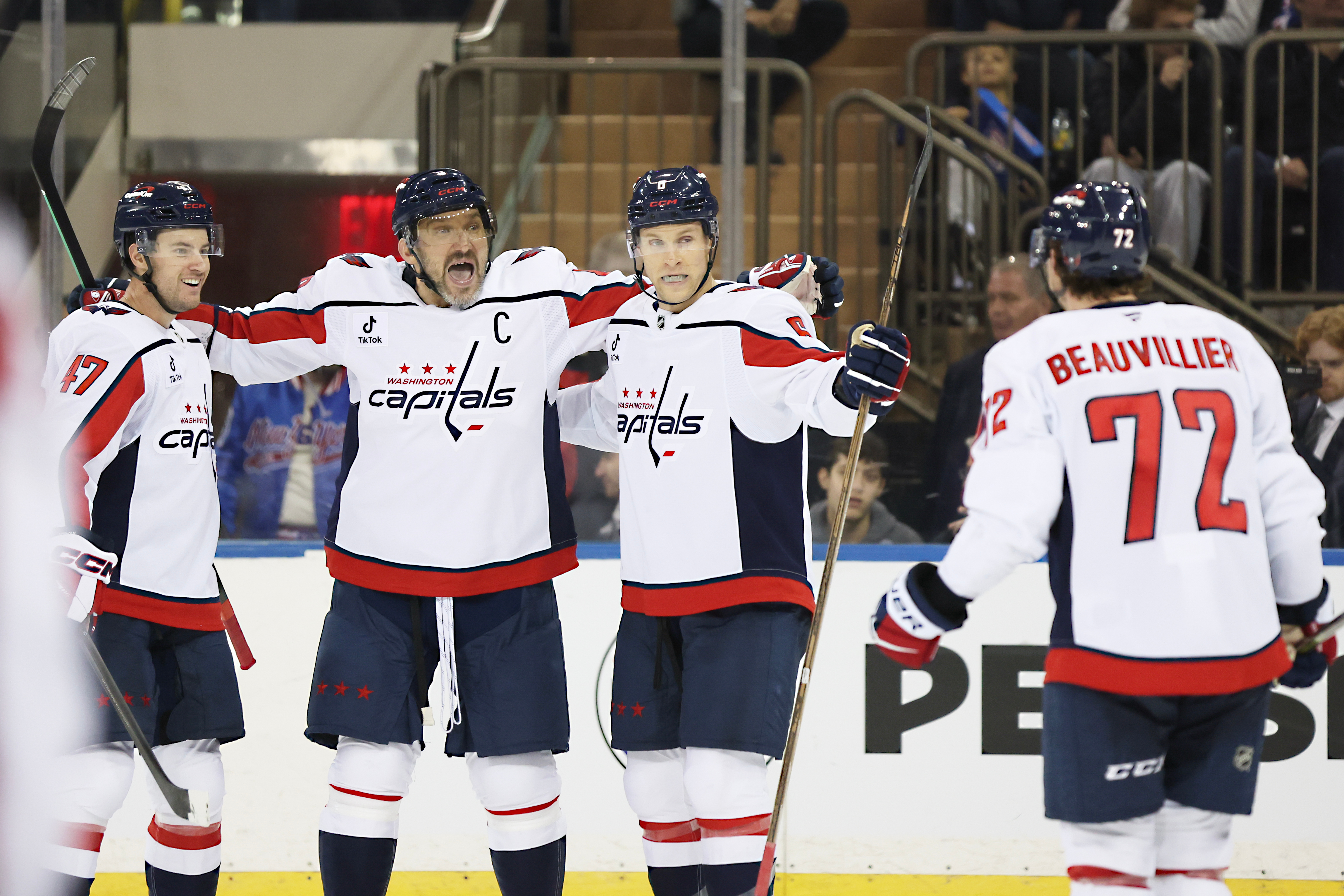Washington Capitals players react after a goal by Anthony Beauvillier (72) during the second period of an NHL hockey game against the New York Rangers, Sunday, Oct. 12, 2025, in New York.