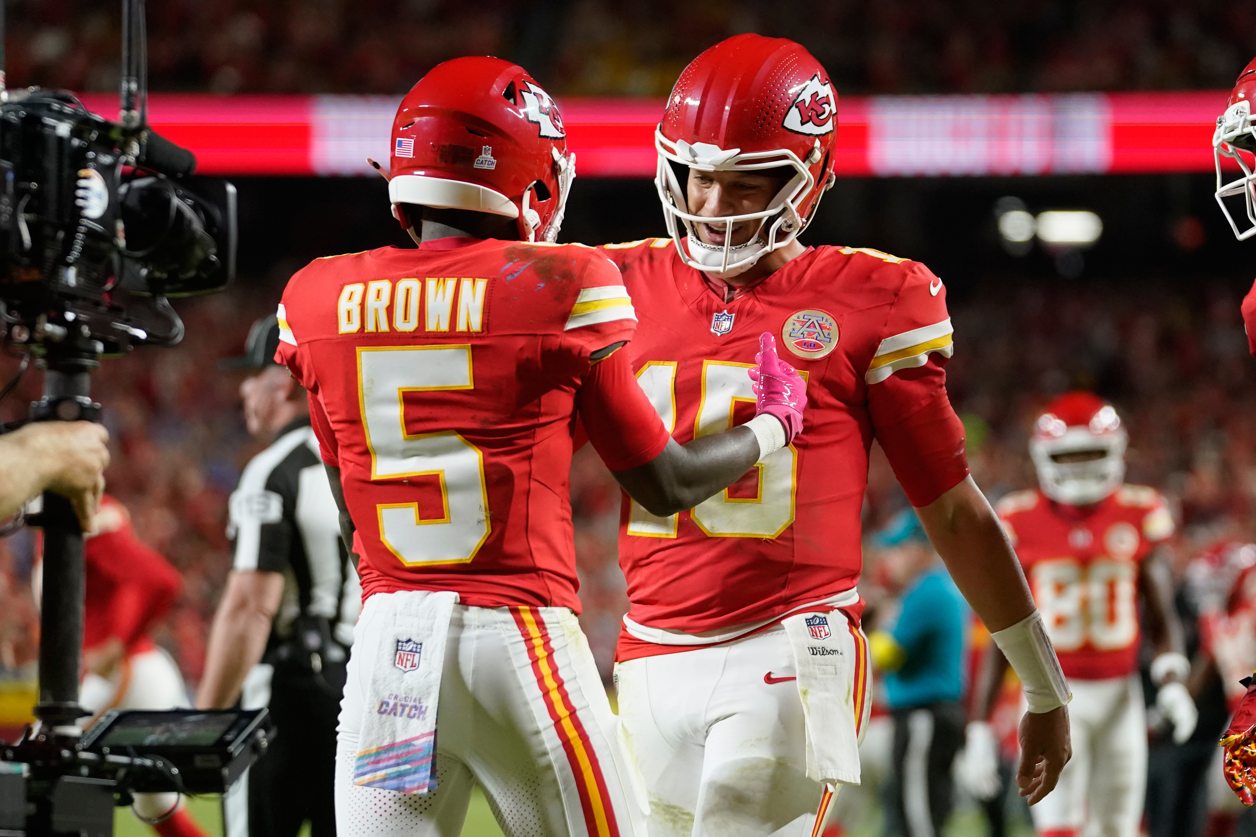 Kansas City Chiefs wide receiver Hollywood Brown (5) is congratulated by quarterback Patrick Mahomes (15) after scoring during the second half of an NFL football game against the Detroit Lions Sunday, Oct. 12, 2025, in Kansas City, Mo.