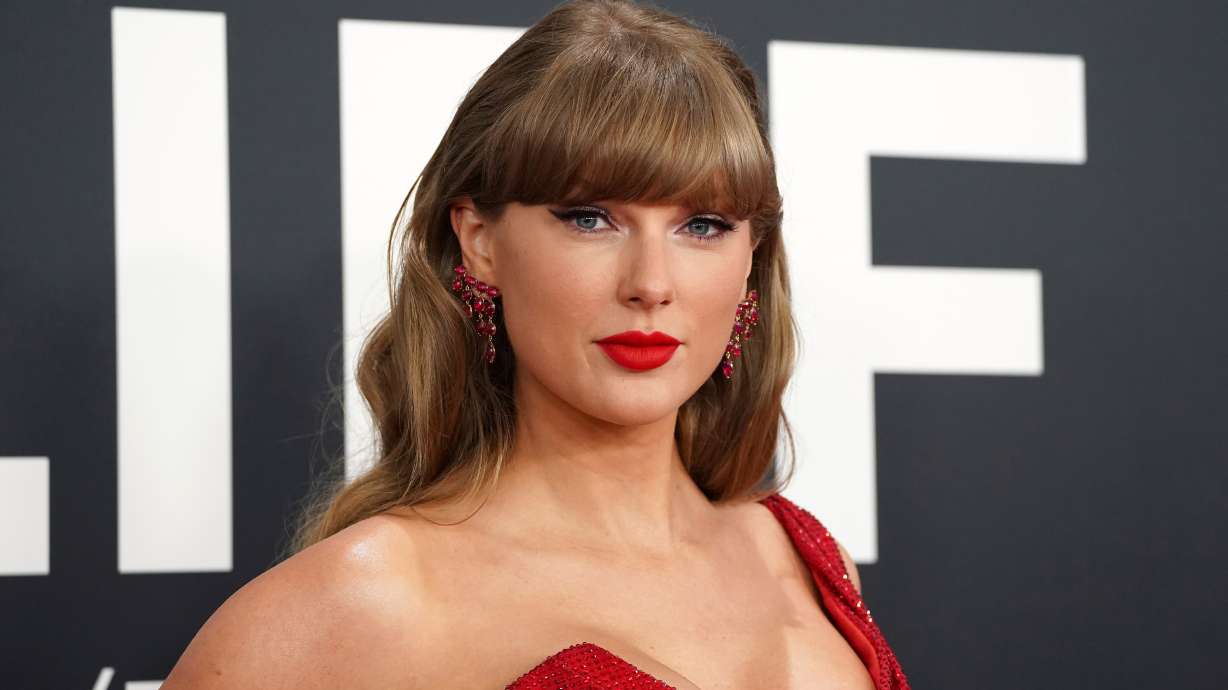 Taylor Swift arrives at the 67th annual Grammy Awards on Feb. 2, 2025, in Los Angeles. Swift and Bad Bunny top Spotify's first all-time most-streamed artists list.