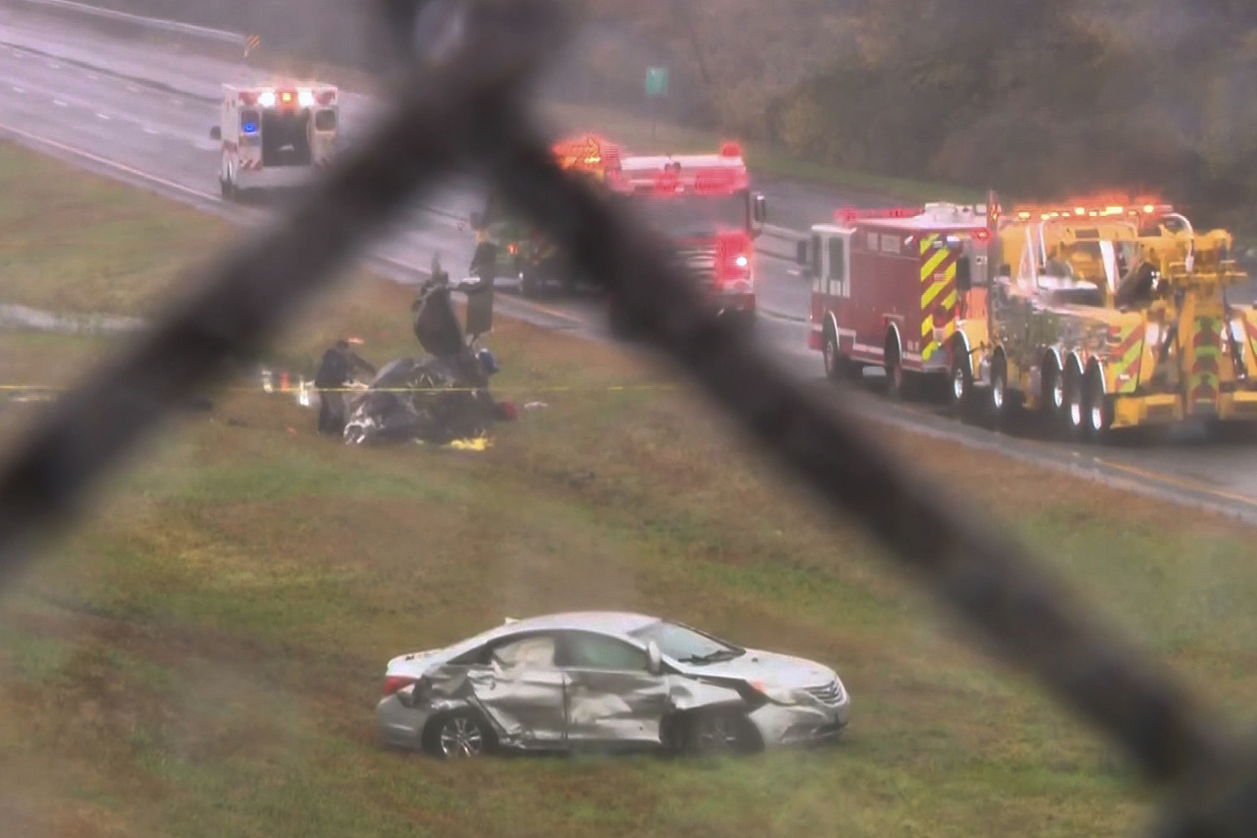 This image made from video provided by WCVB-TV, shows the scene after a small plane crashed onto a highway in Dartmouth, Mass., Monday.