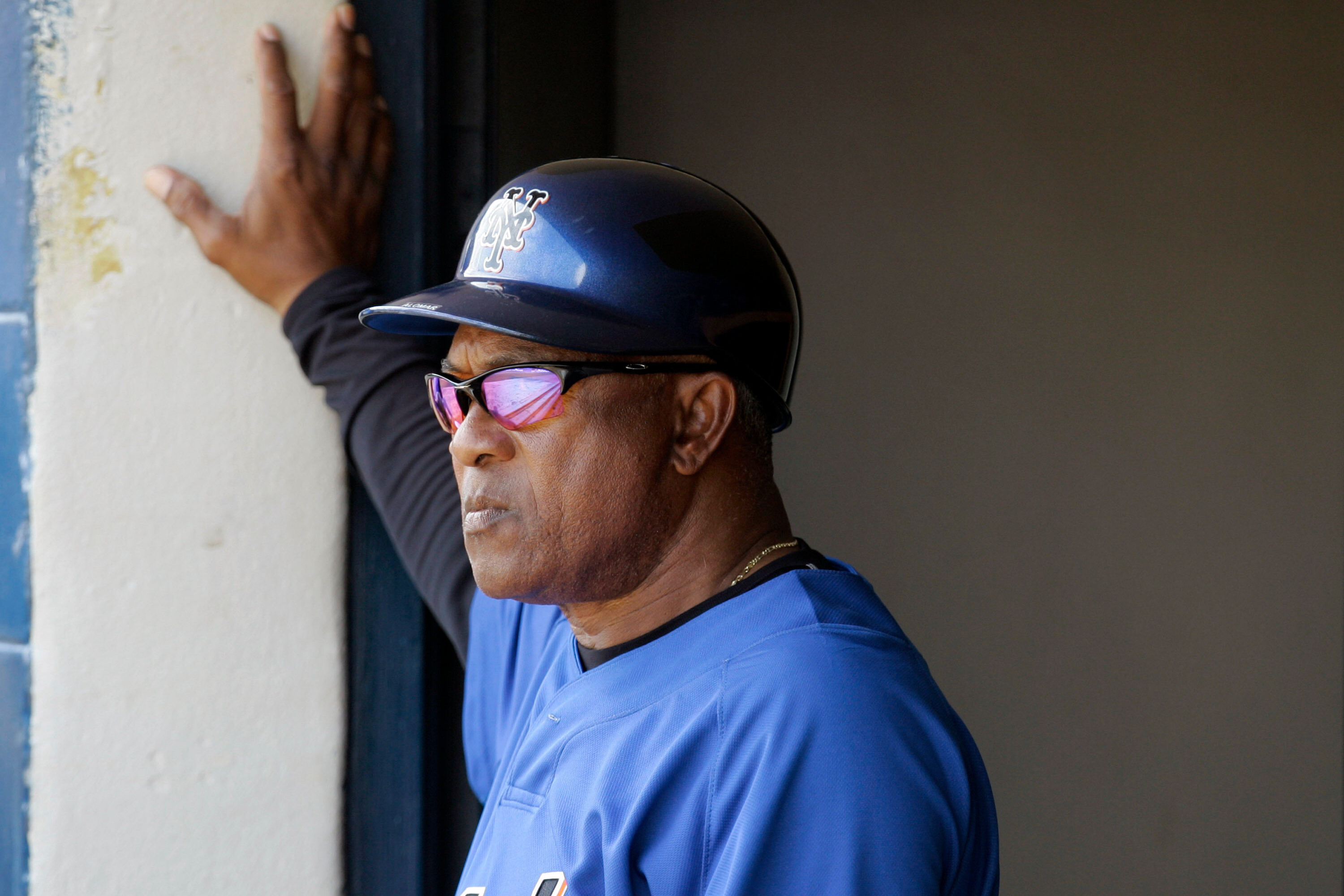 FILE - New York Mets coach Sandy Alomar Sr. watches from the dugout as the Mets play the Cleveland Indians in a spring training baseball game, March 7, 2008, in Winter Haven, Fla.