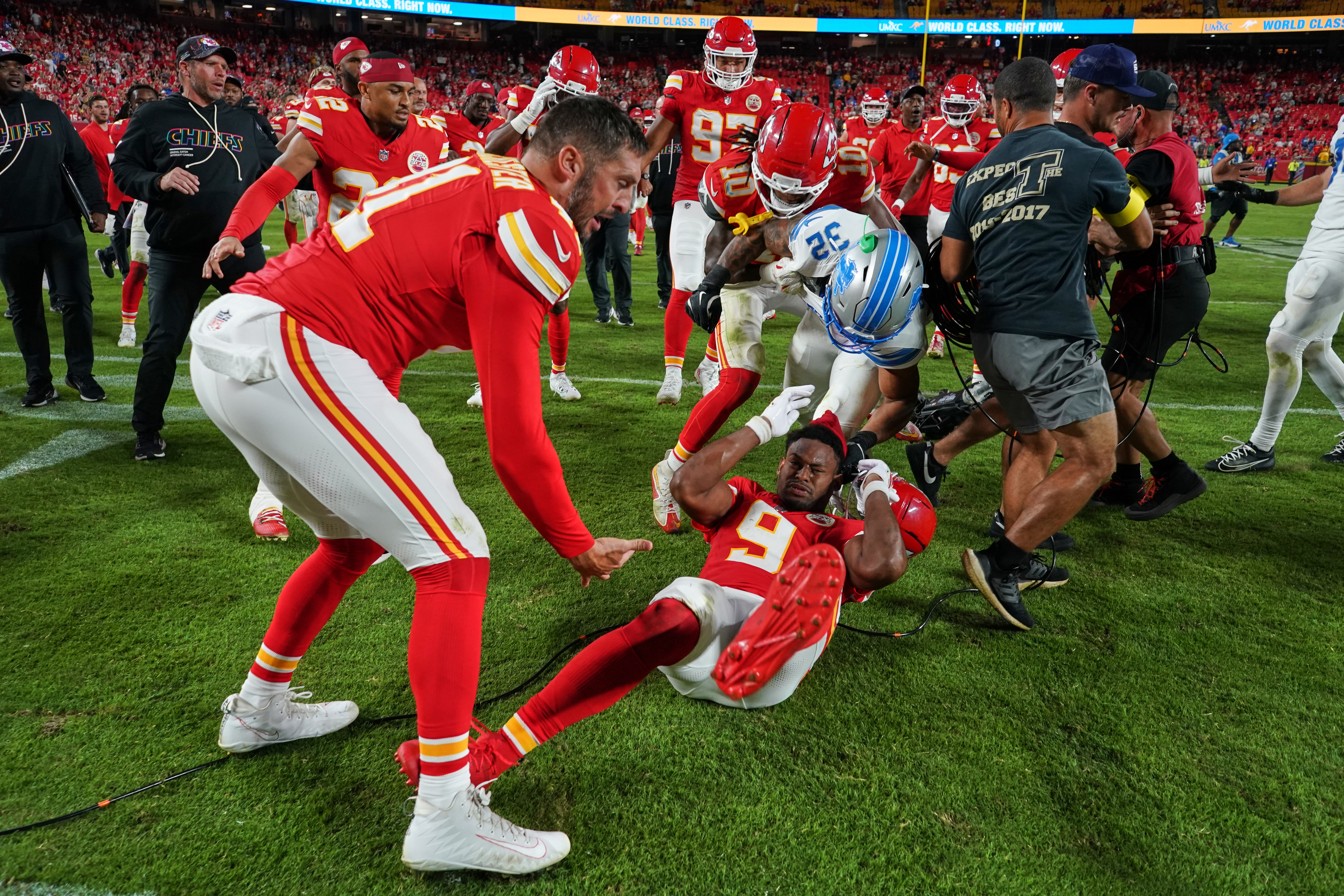 Detroit Lions defensive back Brian Branch (32) fights with Kansas City Chiefs wide receiver JuJu Smith-Schuster (9) while be held back by Chiefs' James Winchester, left, and Isiah Pacheco (10) following an NFL football game Sunday, Oct. 12, 2025, in Kansas City, Mo.