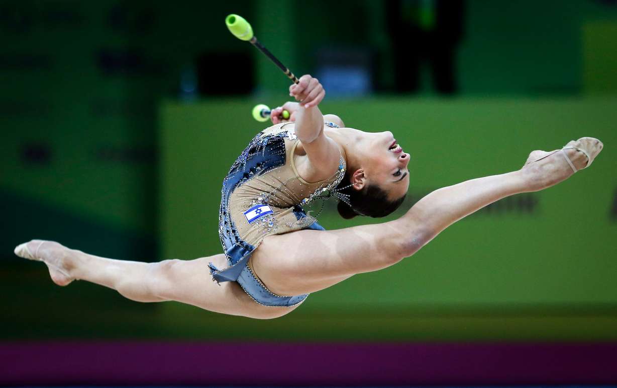 Linoy Ashram of Israel performs with the clubs during the 36th European Rhythmic Gymnastics Championships in Kyiv, Ukraine, Nov. 29, 2020.