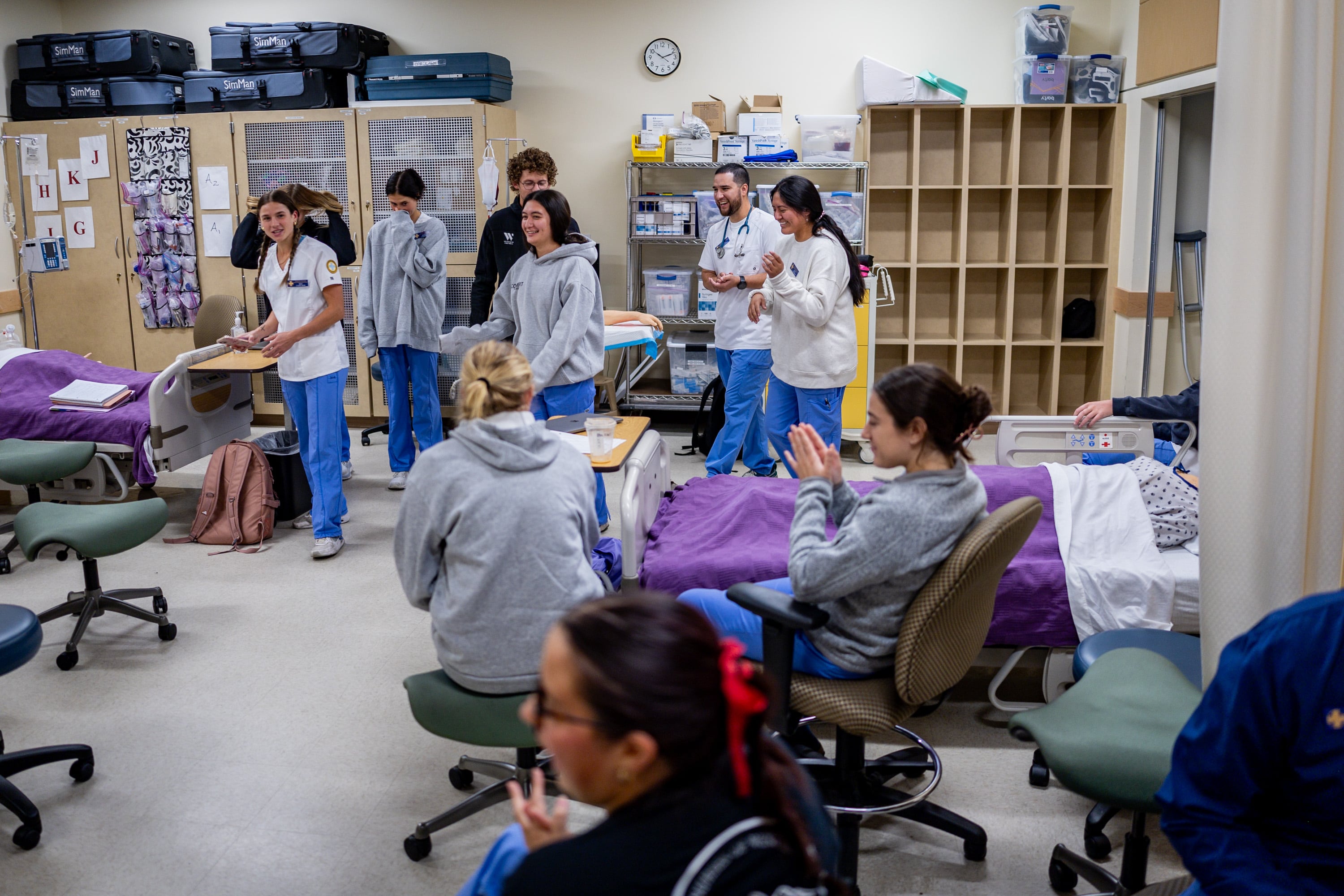 Nursing students clap after performing an interpretive dance that has the same beat as the cardiac rhythm, which they were assigned to mimic with a song, in their Foundations 2 lab class at Westminster's School of Nursing and Health Sciences in Salt Lake City on Sept. 24.