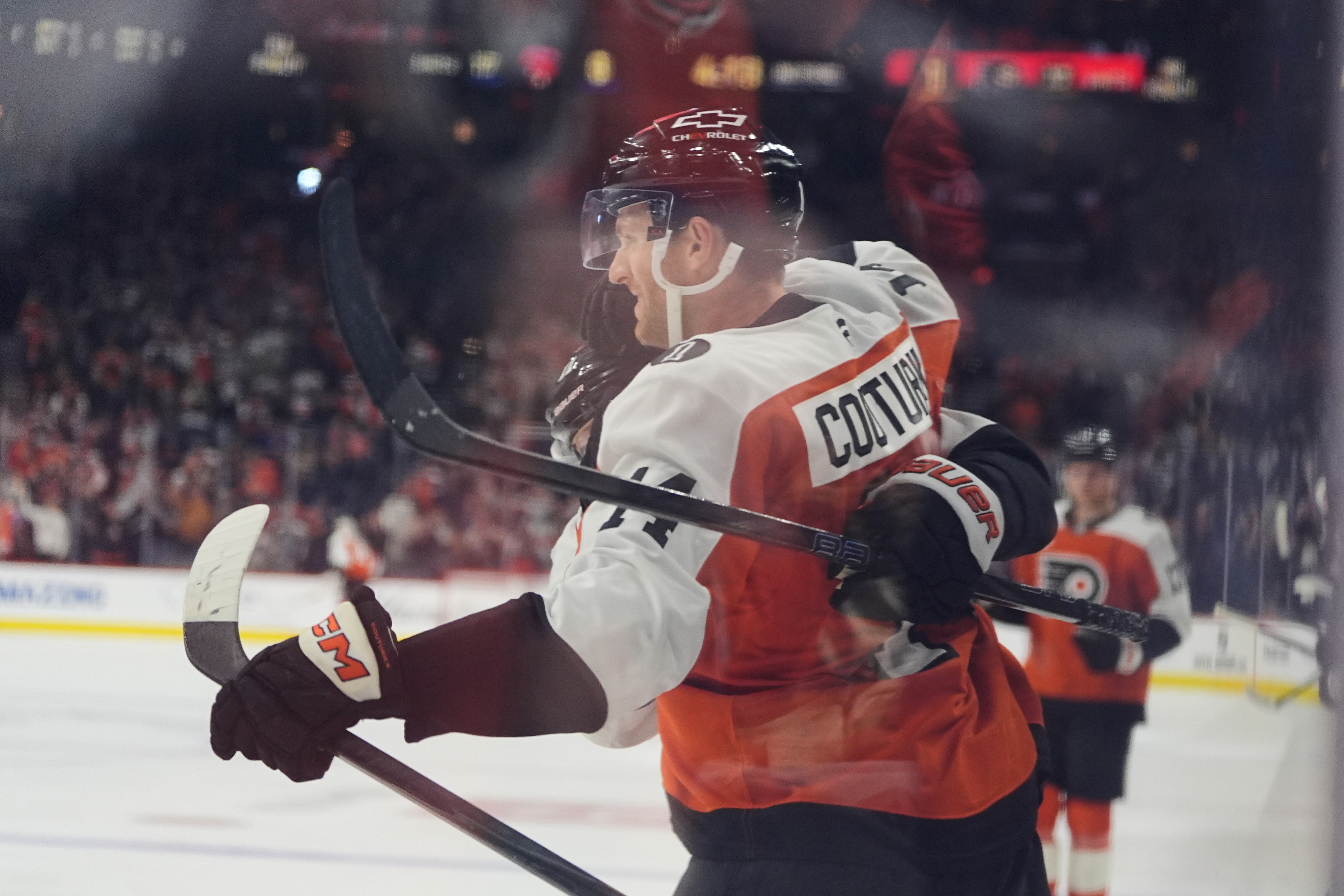 Philadelphia Flyers' Sean Couturier celebrates after scoring past Florida Panthers goaltender Daniil Tarasov during the second period of an NHL hockey game, Monday, Oct. 13, 2025, in Philadelphia.