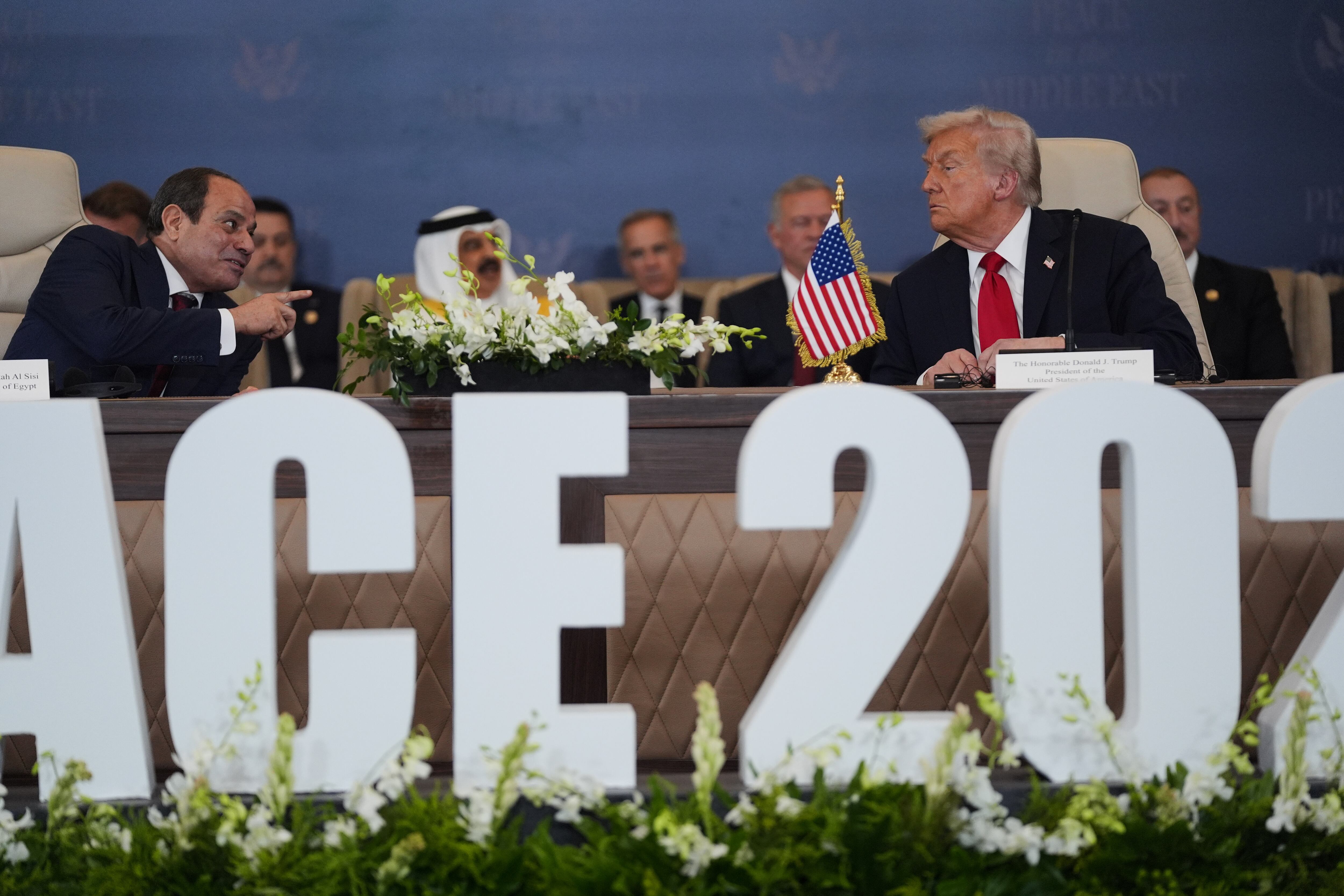 President Donald Trump and Egypt's President Abdel-Fattah el-Sisi talk during a summit to support ending the more than two-year Israel-Hamas war in Gaza after a breakthrough ceasefire deal, Monday, in Sharm El Sheikh, Egypt.