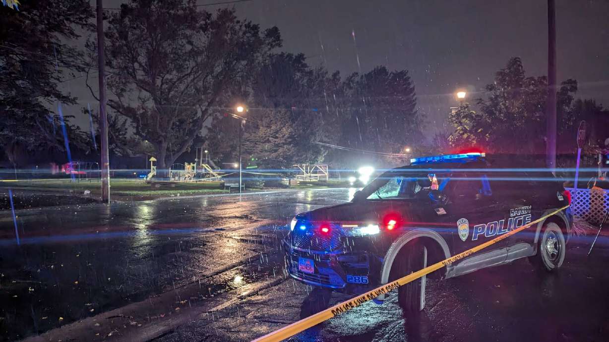 Sandy police investigate a fatal shooting near a park on Monday.