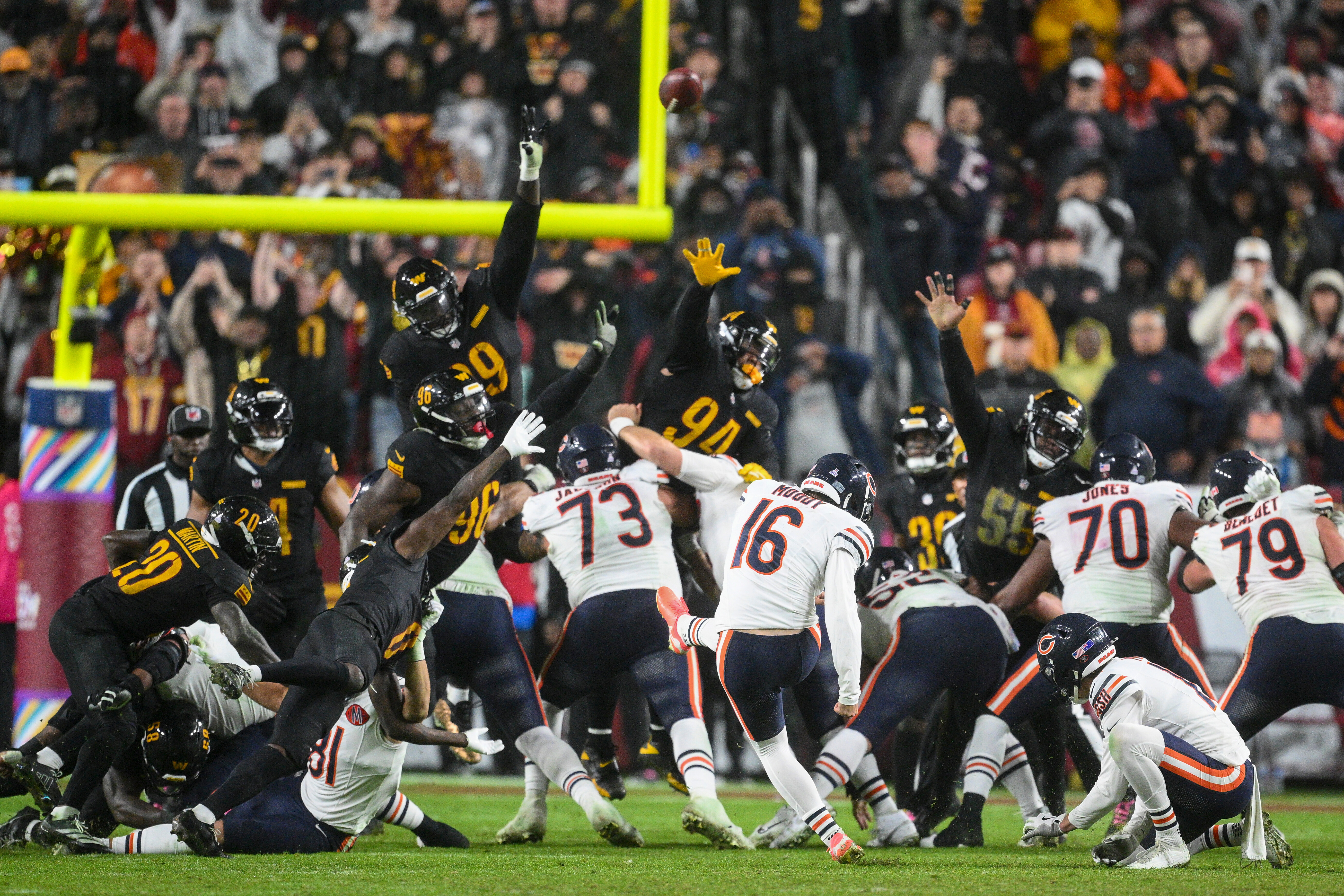 Chicago Bears kicker Jake Moody (16) kicks the game-winning field goal as time expires in an NFL football game against the Washington Commanders, Monday, Oct. 13, 2025, in Landover, Md.