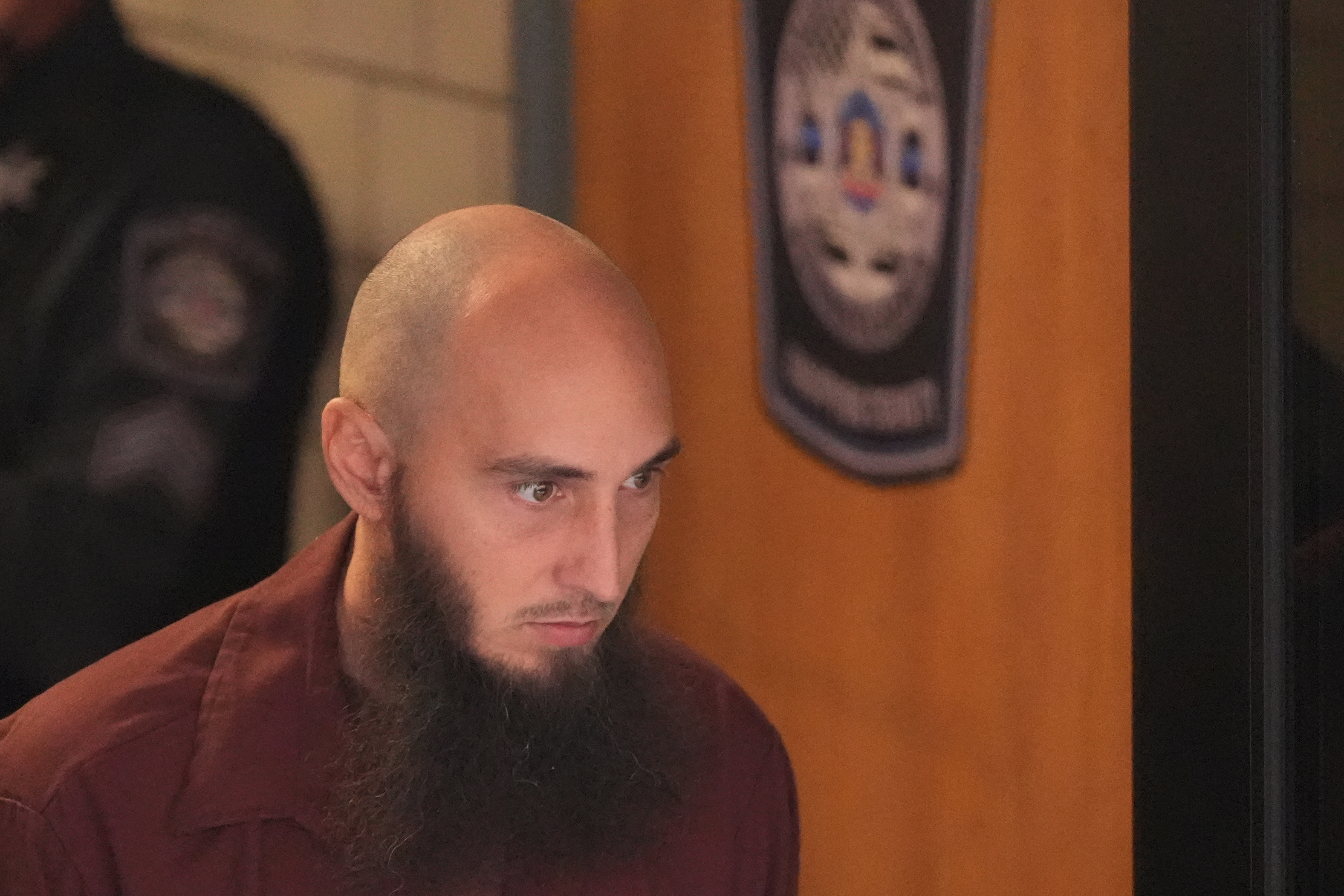 Cody Balmer, accused of setting a fire at Pennsylvania Gov. Josh Shapiro's official residence, leaves Dauphin County Courthouse on Tuesday in Harrisburg, Pa. Balmer pleaded guilty to an attempted murder charge.