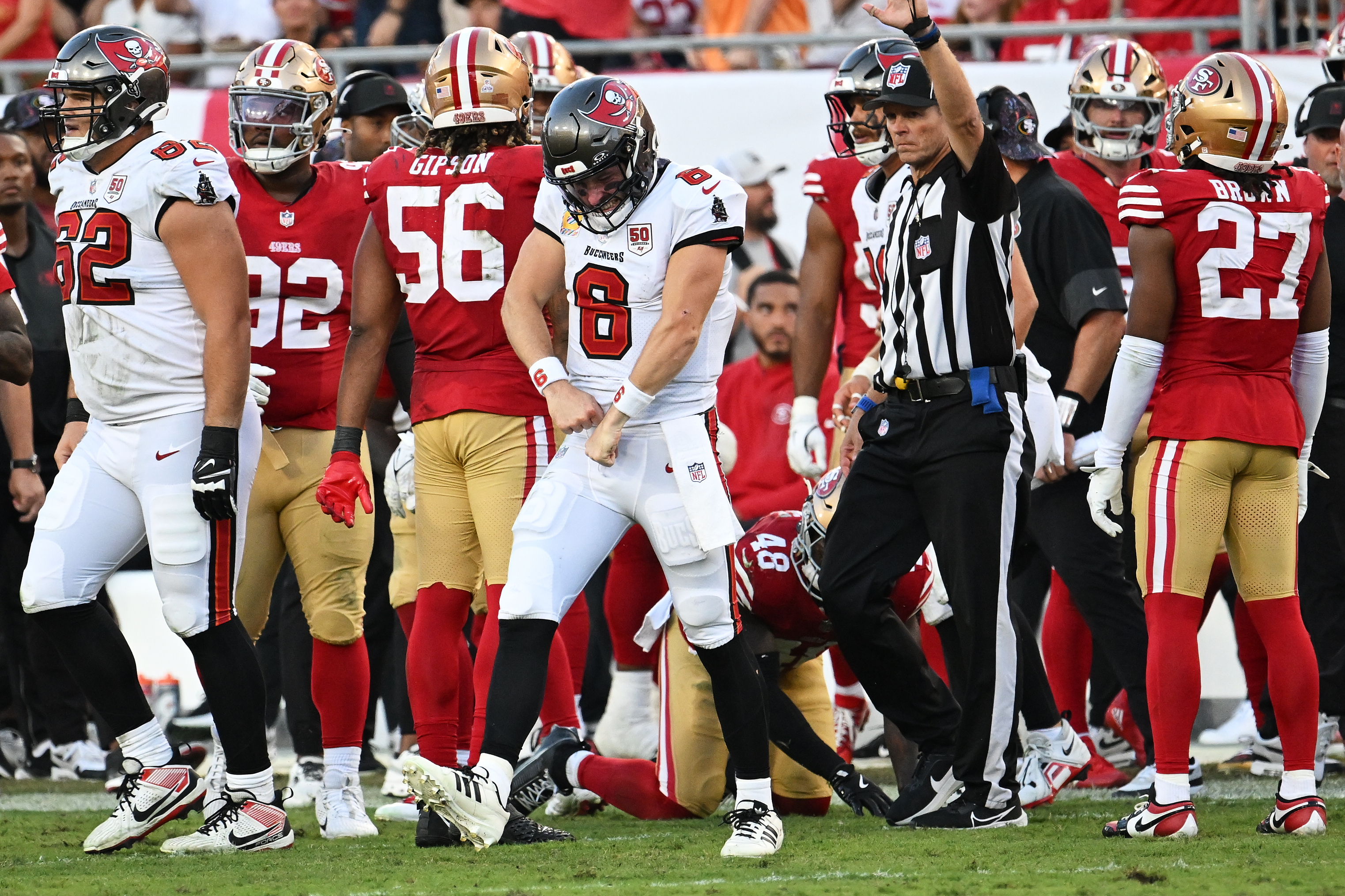 Tampa Bay Buccaneers quarterback Baker Mayfield (6) reacts after running for a first down during the second half of an NFL football game against the San Francisco 49ers in Tampa, Fla., Sunday, Oct. 12, 2025.