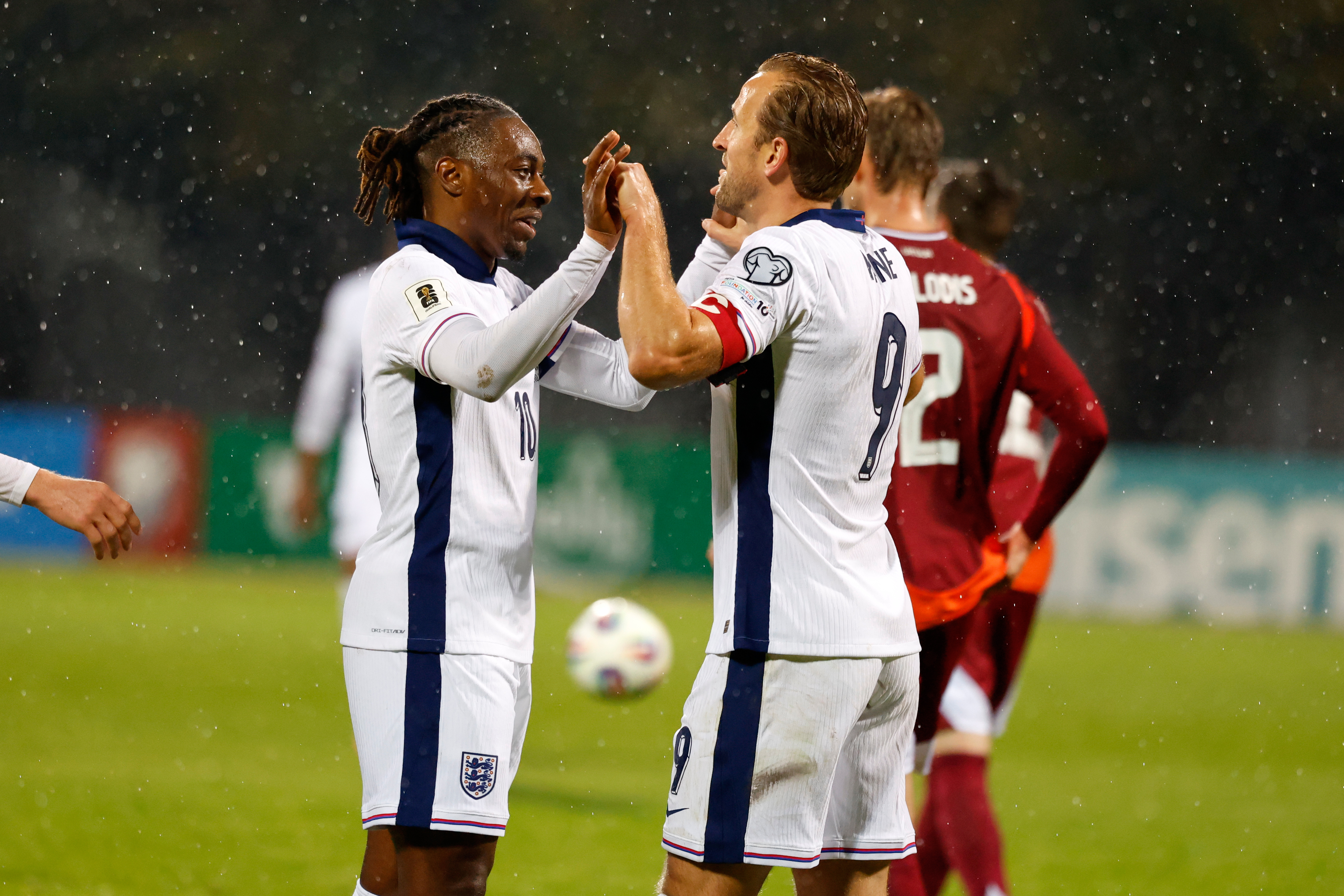 England's Eberechi Eze, left, celebrates with Harry Kane after scoring his side's fifth goal during the 2026 World Cup group K qualifying soccer match between Latvia and England in Riga, Latvia, Tuesday, Oct. 14, 2025.