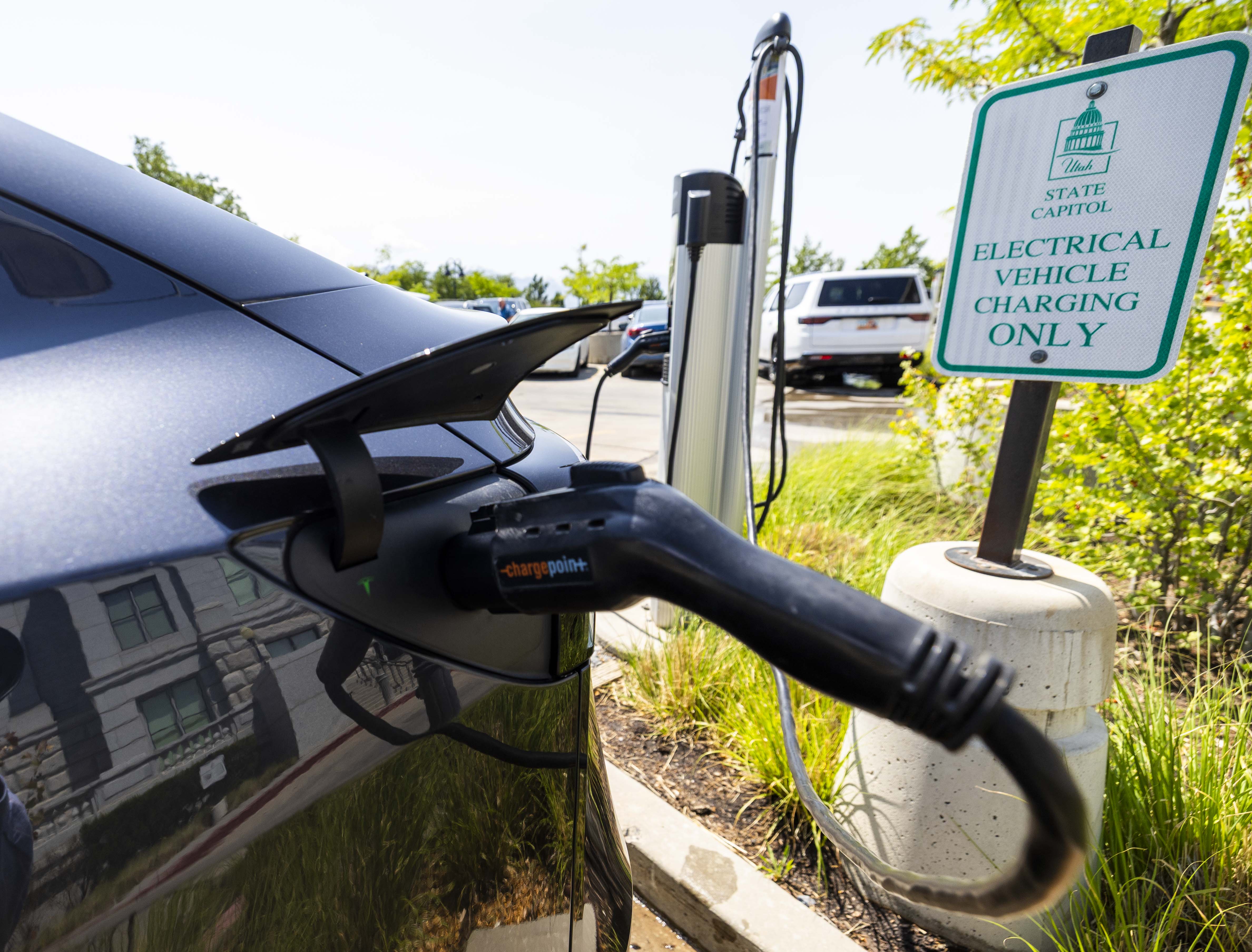 A car at an electric vehicle charging station at the Capitol in Salt Lake City on June 25. Utah ranks high in vehicle efficiency, according to a new report.