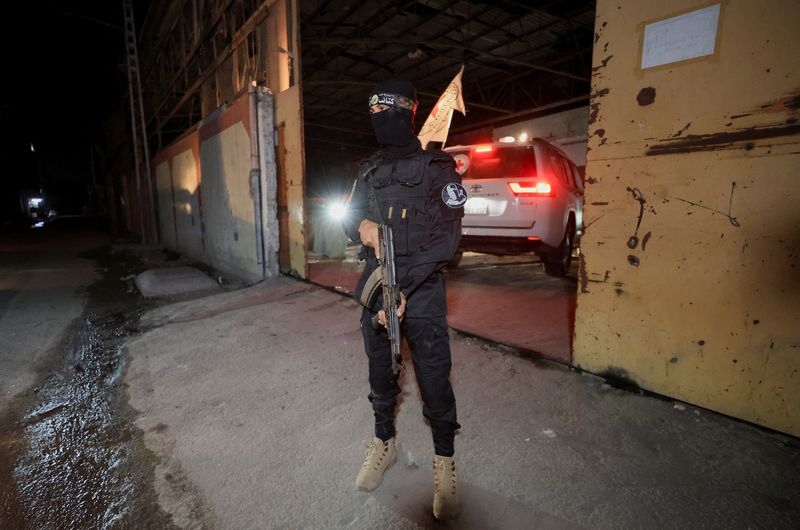 Hamas hands over hostage bodies after Israel threatens aid cut
