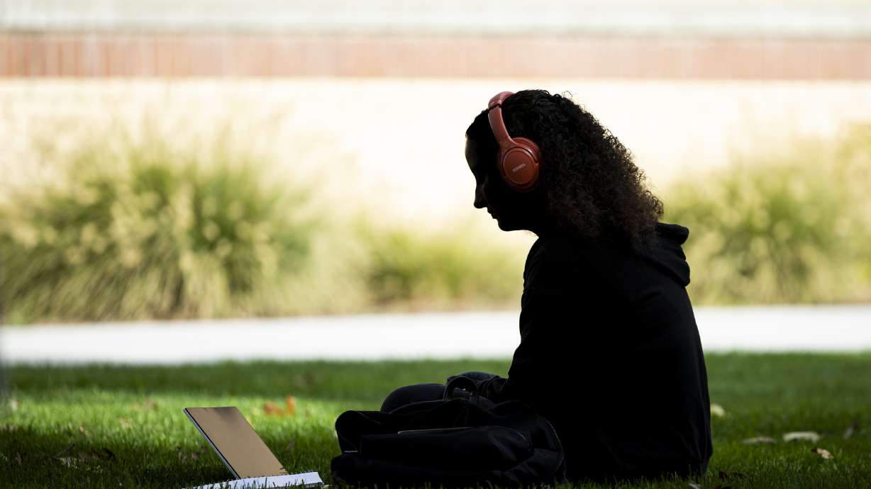 A student uses a computer on the campus of Utah State University in Logan on Oct. 1. Enrollment is growing across institutions under the Utah System of Higher Education umbrella, according to recently released data.