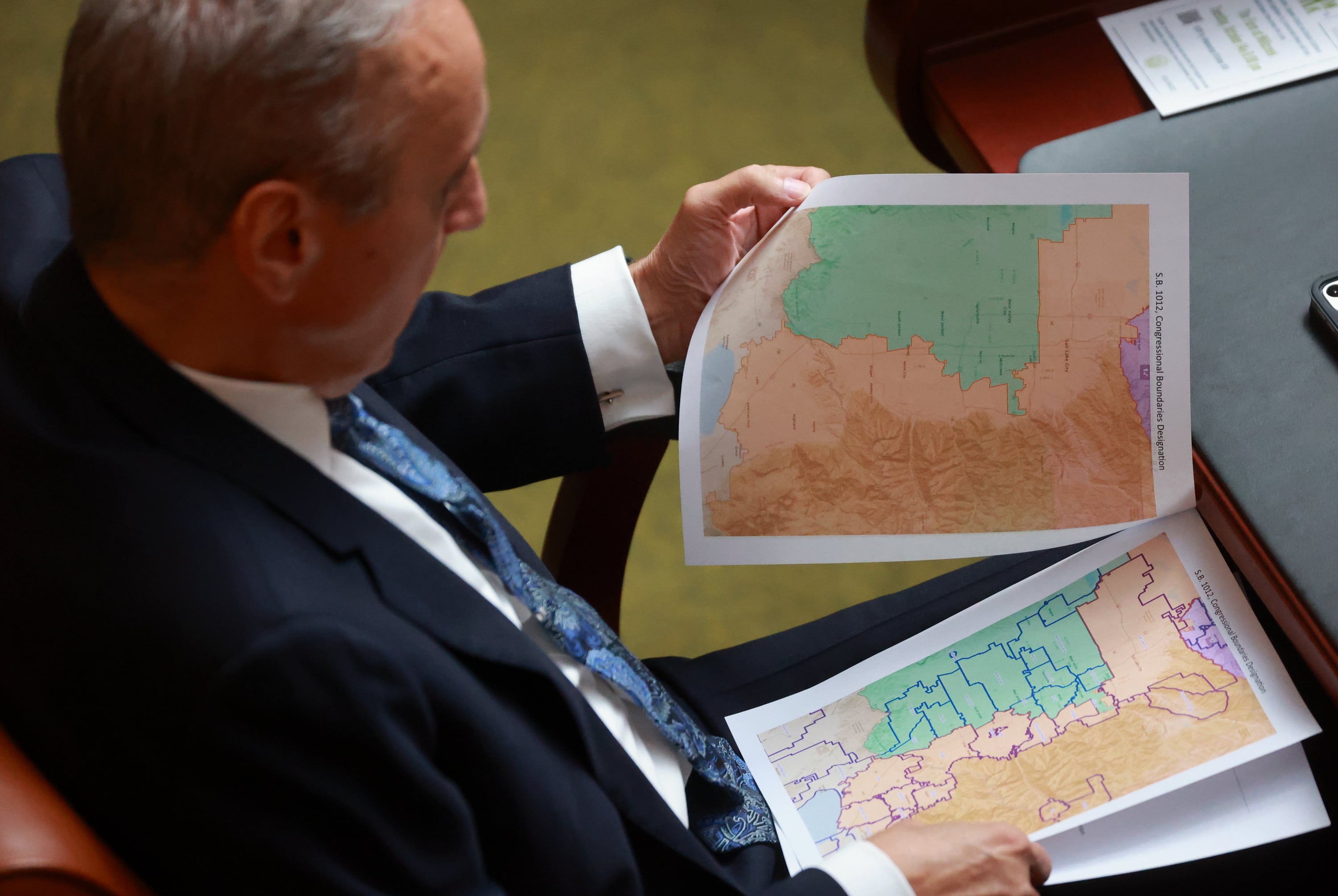 Rep. Cory Maloy, R-Lehi, holds a packet of potential redistricting maps during a special legislative session at the Capitol in Salt Lake City on Oct. 6. Lawmakers chose Map C, which was deemed favorable to Republicans.