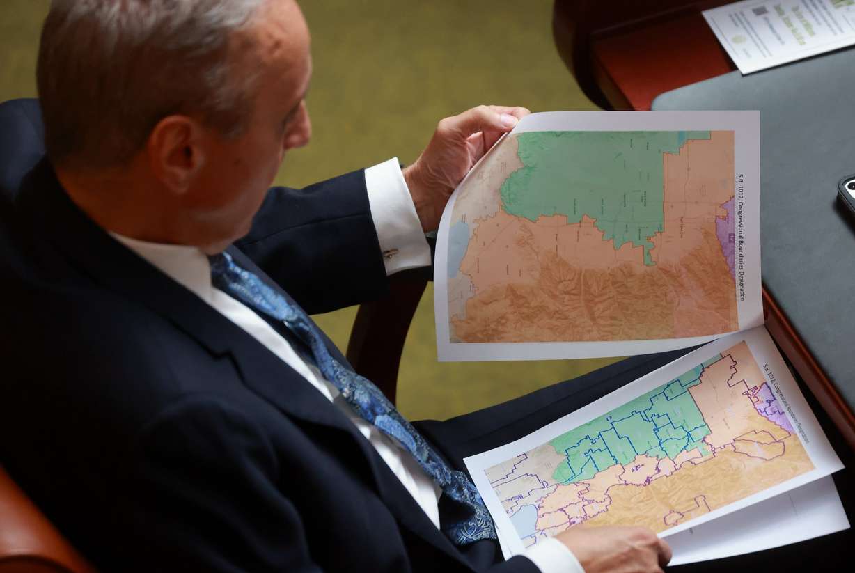 Rep. Cory Maloy, R-Lehi, holds a packet of potential redistricting maps during a special legislative session at the Capitol in Salt Lake City on Oct. 6. Lawmakers chose Map C, which was deemed favorable to Republicans.