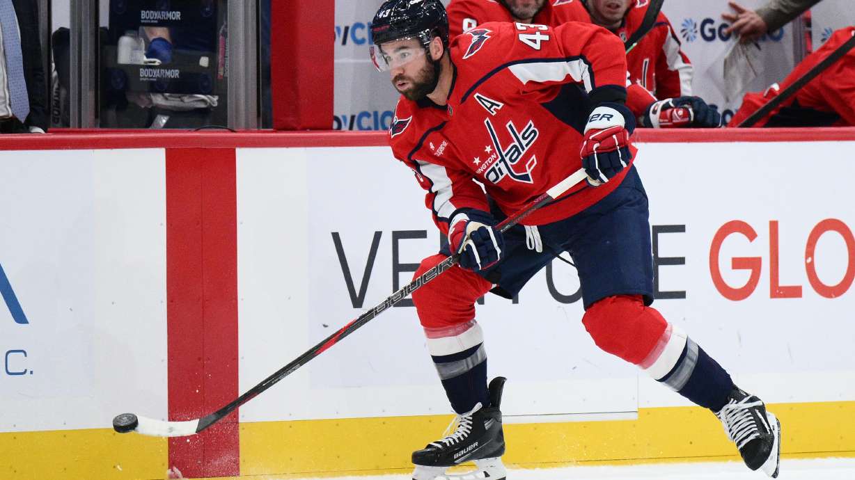 Washington Capitals right wing Tom Wilson (43) skates with the puck during the first period of an NHL hockey game against the Tampa Bay Lightning, Tuesday, Oct. 14, 2025, in Washington.