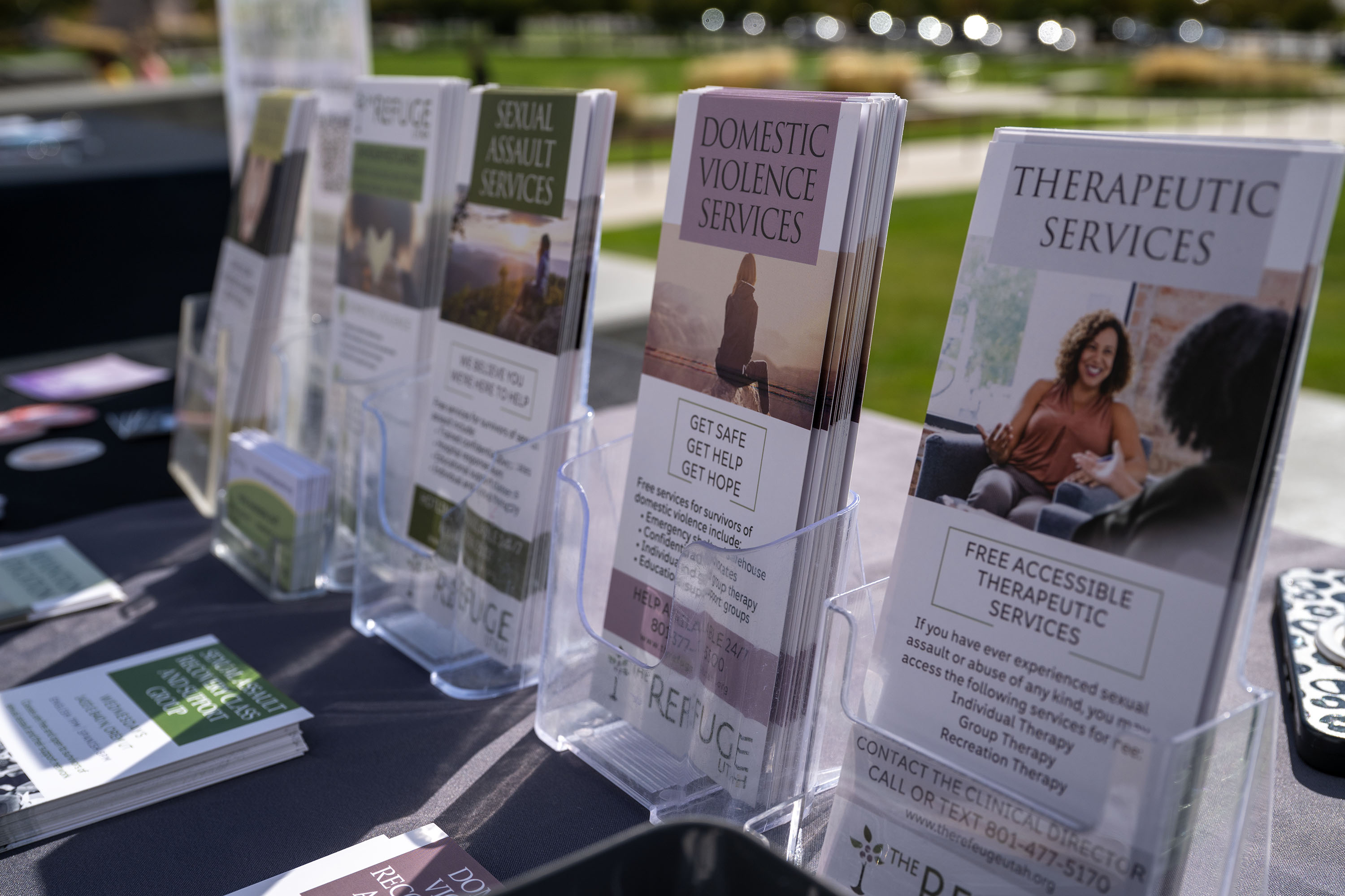 Literature and other items sit out for the taking while at a Domestic violence rally at the Capitol in Salt Lake City on Tuesday, Oct. 14, 2025.