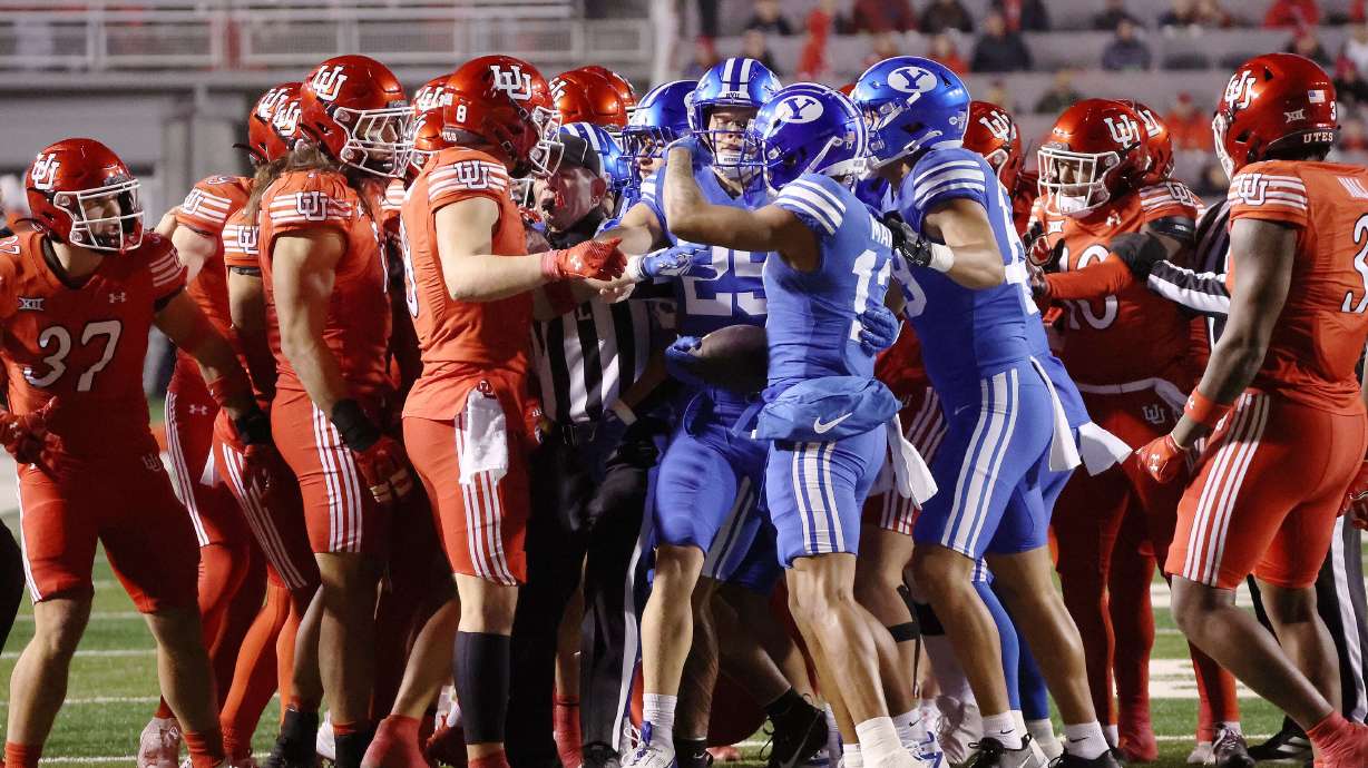 Utah Utes and Brigham Young Cougars tussle at Rice-Eccles Stadium in Salt Lake City on Nov. 9, 2024. Passion that comes with the Utah-BYU football rivalry manifests itself with taunts, verbal altercations and sometimes physical aggression.