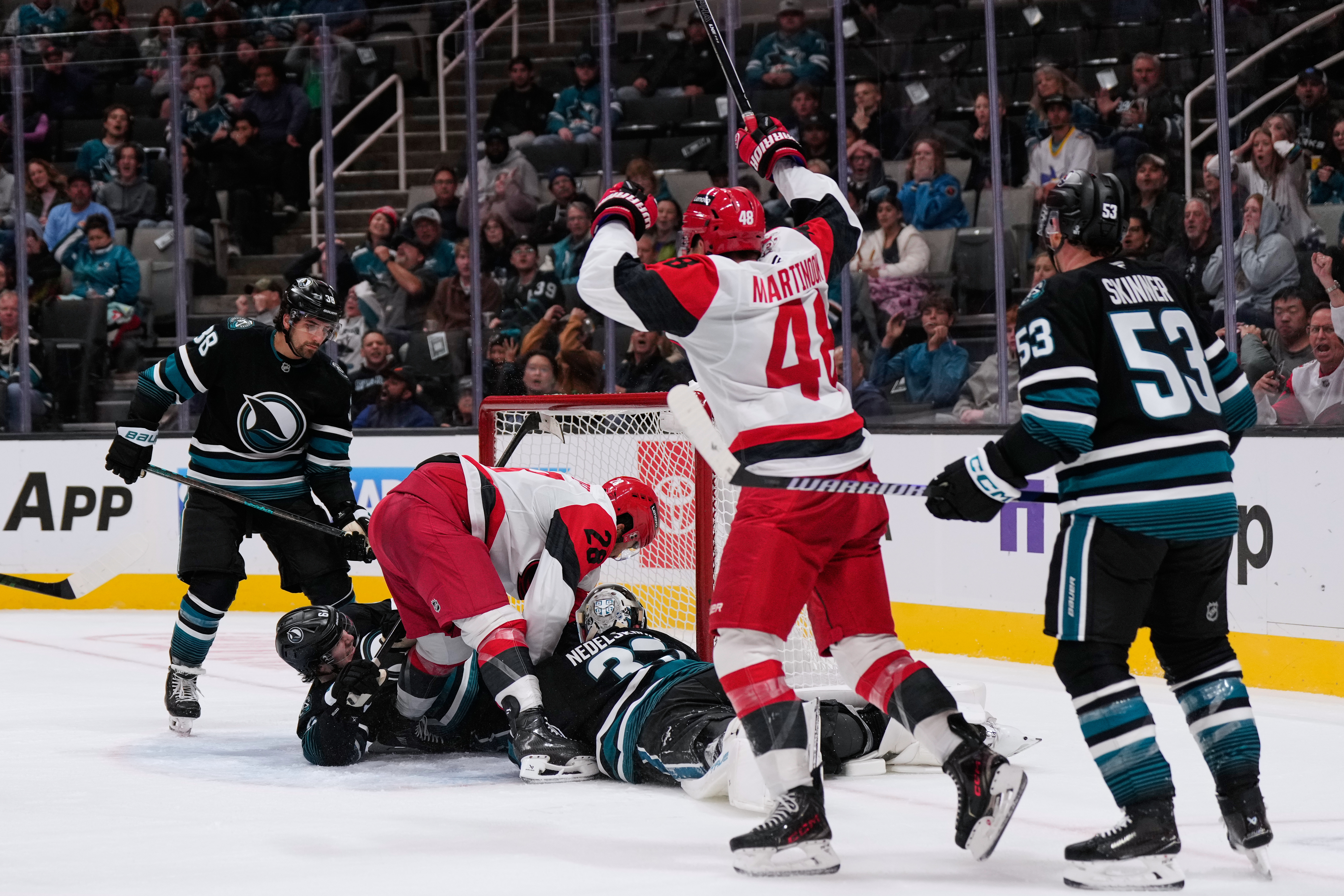 Carolina Hurricanes left wing William Carrier (28) scores a goal against San Jose Sharks goaltender Alex Nedeljkovic (33) during the second period of an NHL hockey game, Tuesday, Oct. 14, 2025, in San Jose, Calif.
